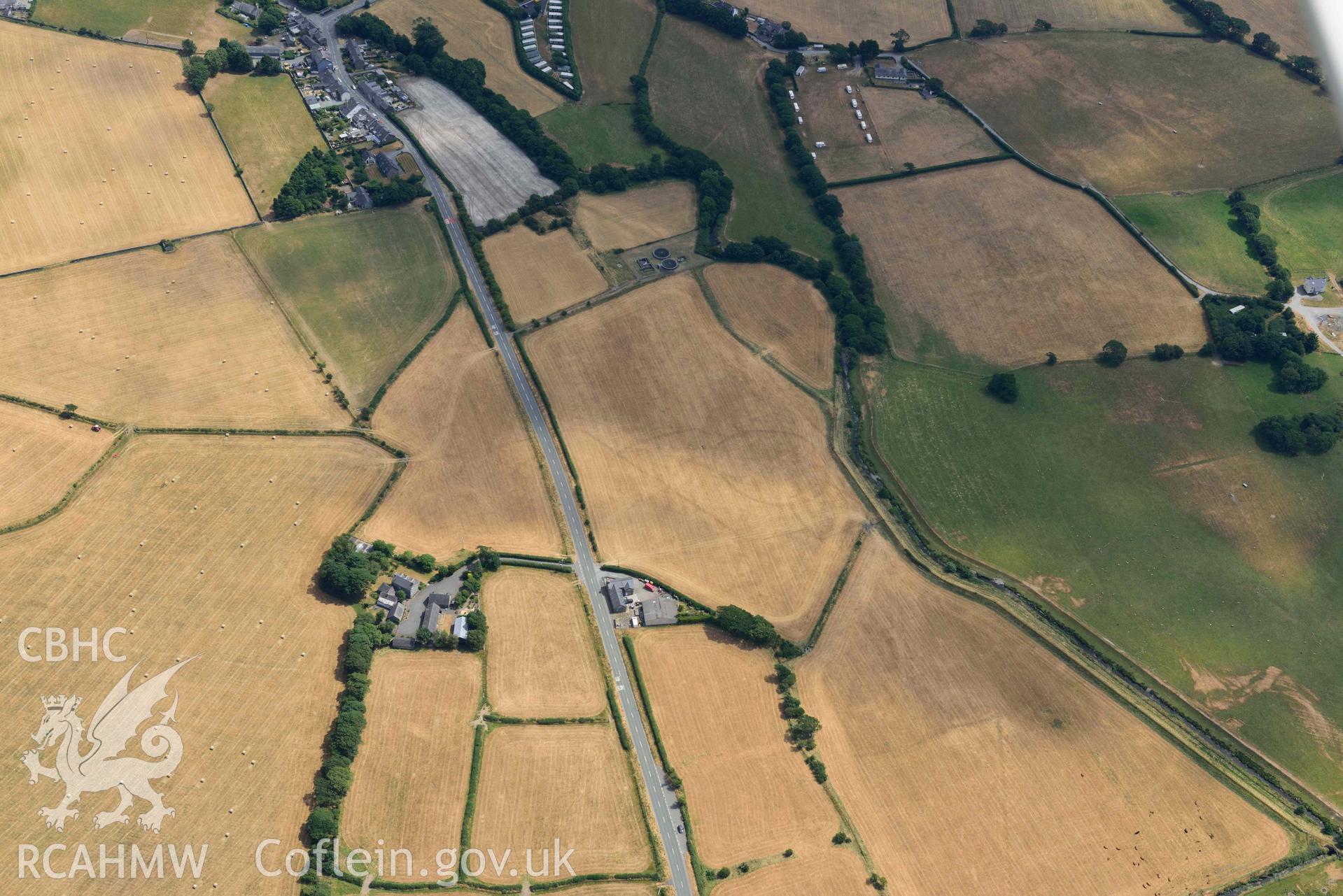 Bryncrug cropmark complex, south-west area. Oblique aerial photograph taken during the Royal Commission’s programme of archaeological aerial reconnaissance by Toby Driver on 10 July 2018.