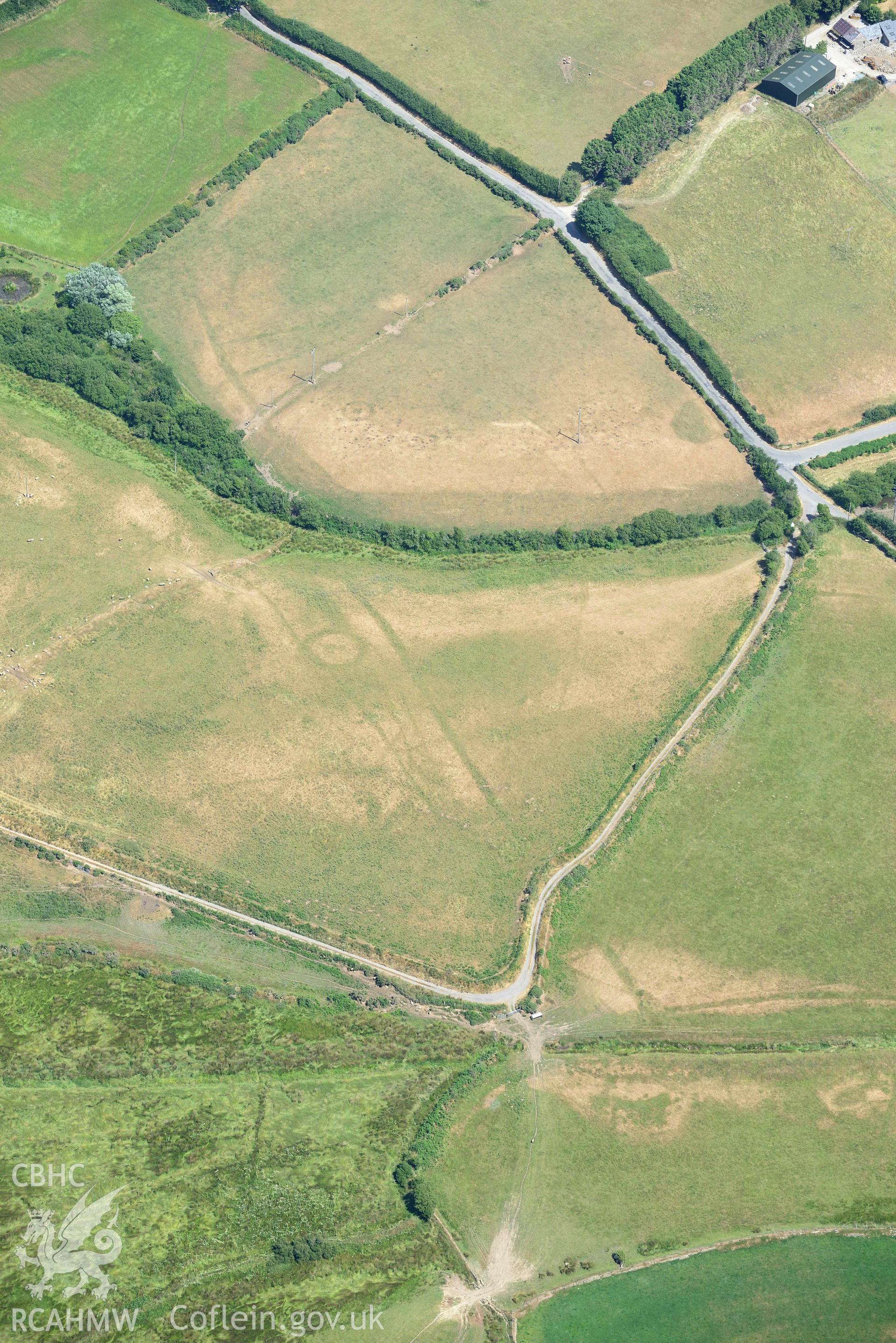 Detailed view of cropmark complex at Llawr-Dref, Llangian. Oblique aerial photograph taken during the Royal Commission’s programme of archaeological aerial reconnaissance by Toby Driver on 10 July 2018.