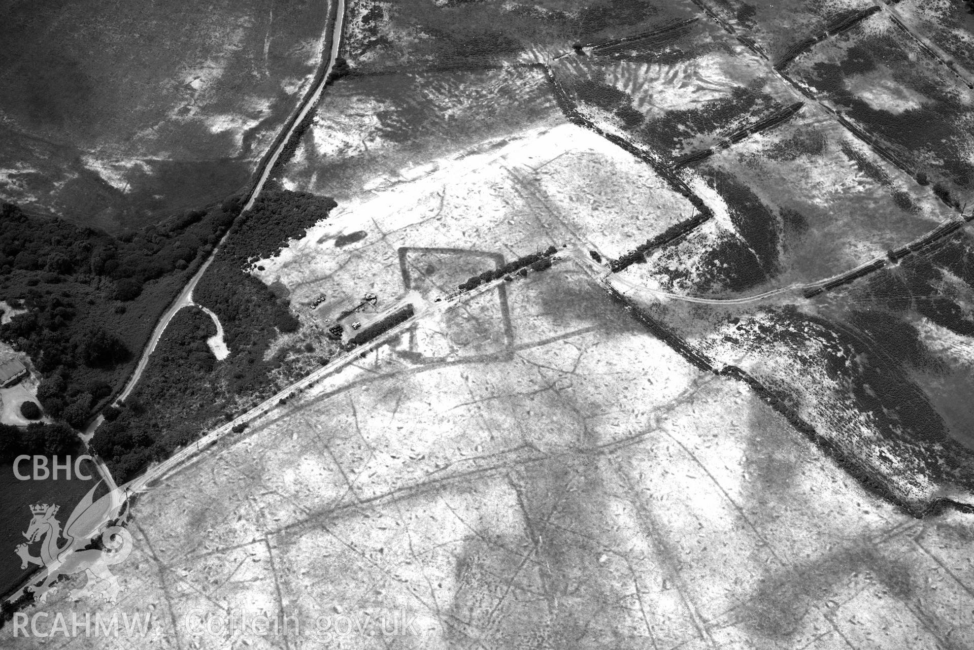 Detailed view of Traian rectangular enclosure. Oblique black and white aerial photograph taken during the Royal Commission’s programme of archaeological aerial reconnaissance by Toby Driver on 10 July 2018.