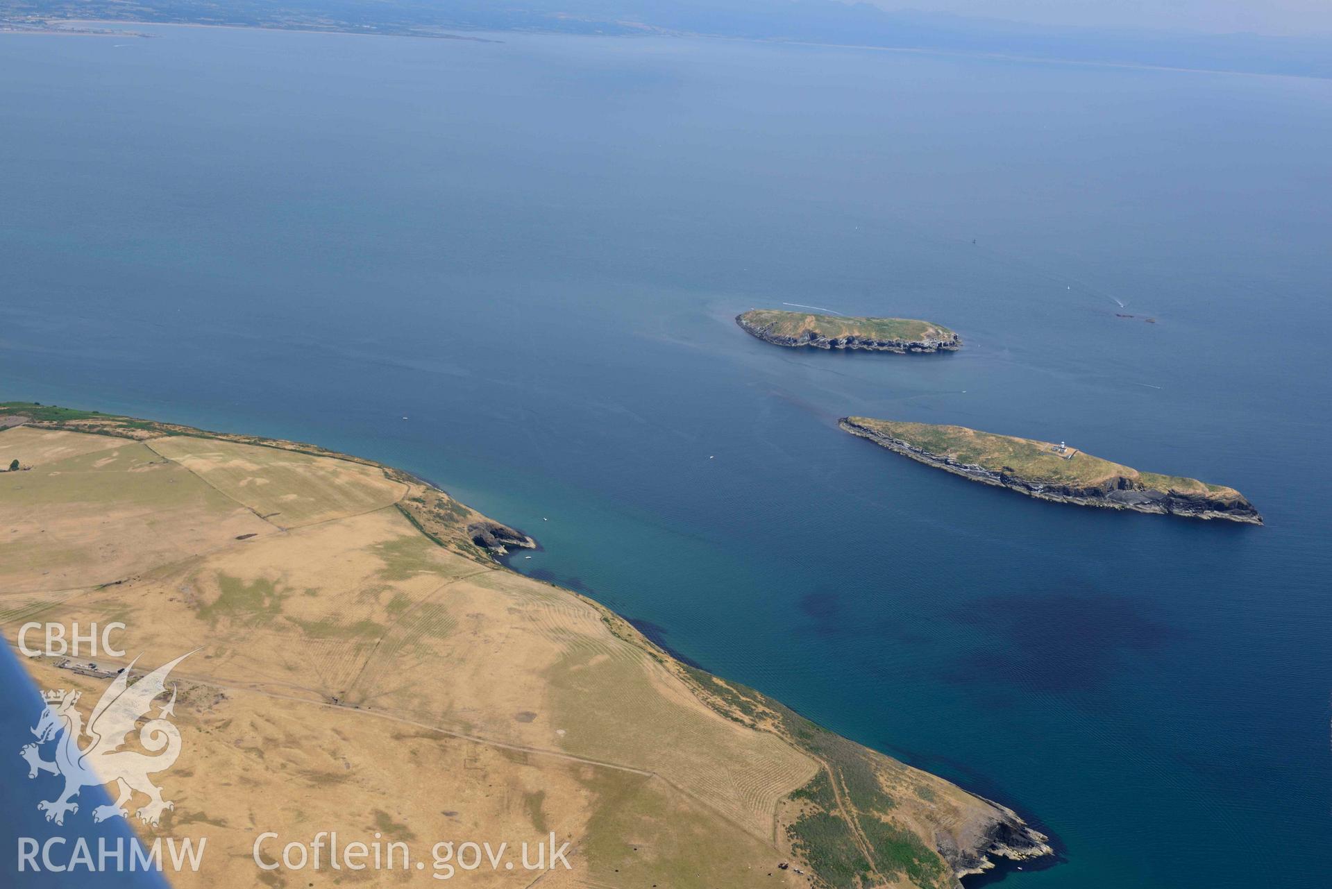 Penrhynmawr field system with St Tudwals islands (West and East) beyond. Oblique aerial photograph taken during the Royal Commission’s programme of archaeological aerial reconnaissance by Toby Driver on 10 July 2018.