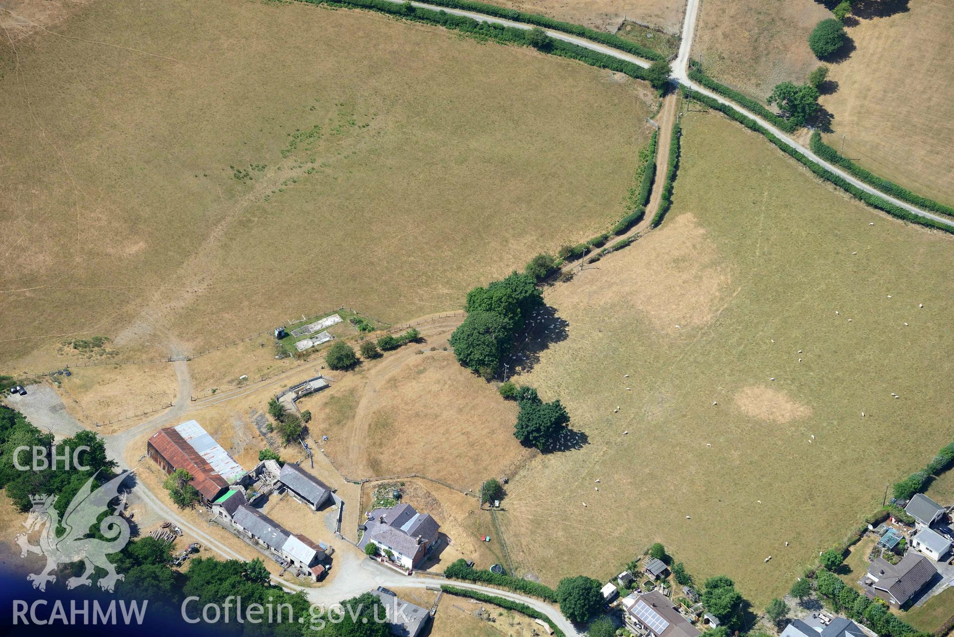 Goginan, with a view of Pen y Bryn (SN 683 809). Oblique aerial photograph taken during the Royal Commission’s programme of archaeological aerial reconnaissance by Toby Driver on 10 July 2018.