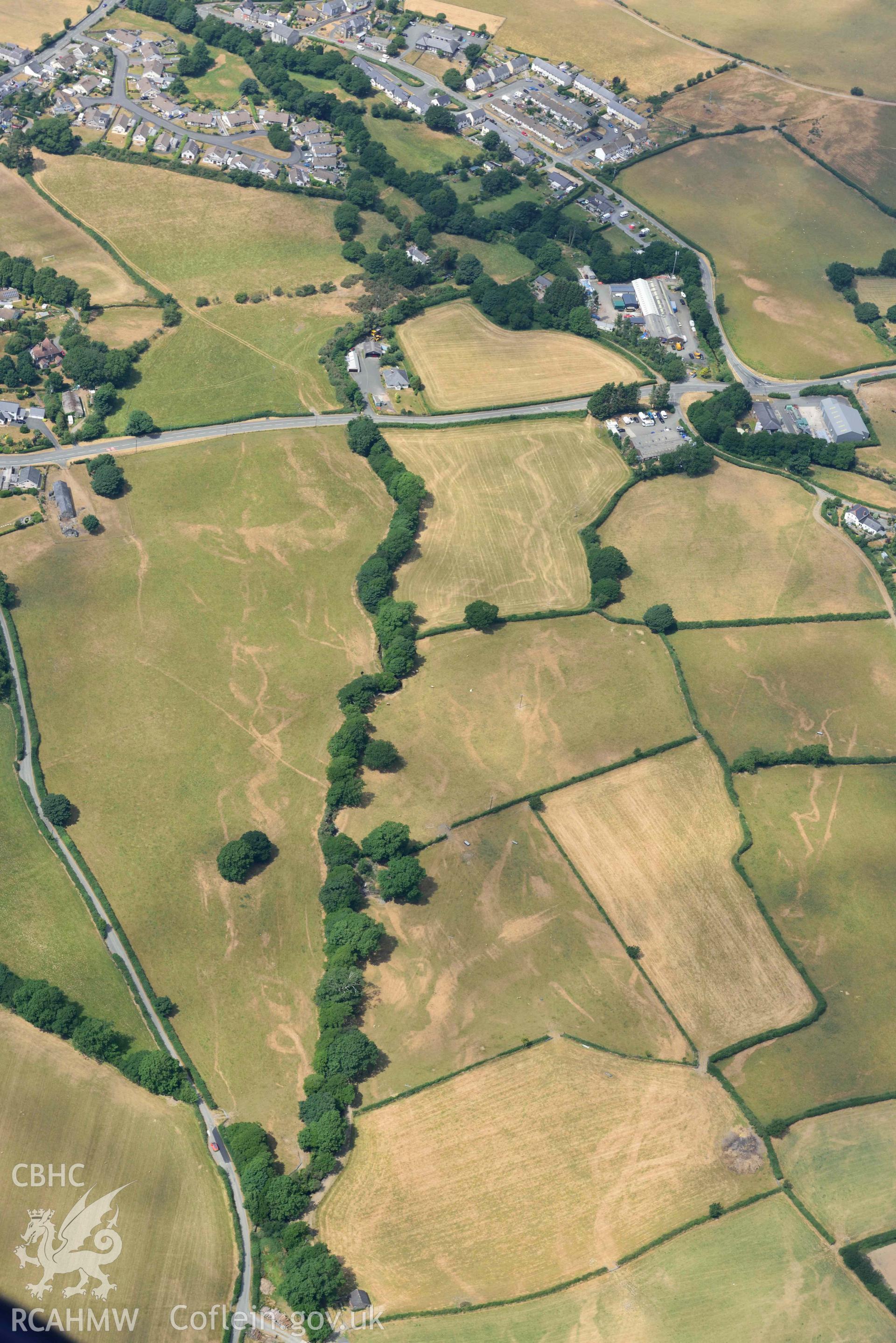 Bryncrug Pont y Felindre cropmarks. Oblique aerial photograph taken during the Royal Commission’s programme of archaeological aerial reconnaissance by Toby Driver on 10 July 2018.