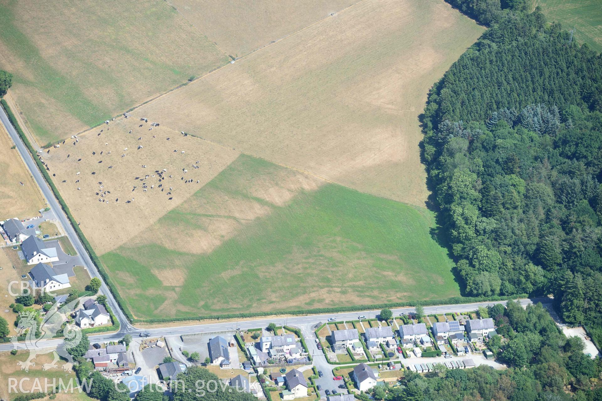 Abermagwr village cropmarks. Oblique aerial photograph taken during the Royal Commission’s programme of archaeological aerial reconnaissance by Toby Driver on 10 July 2018.