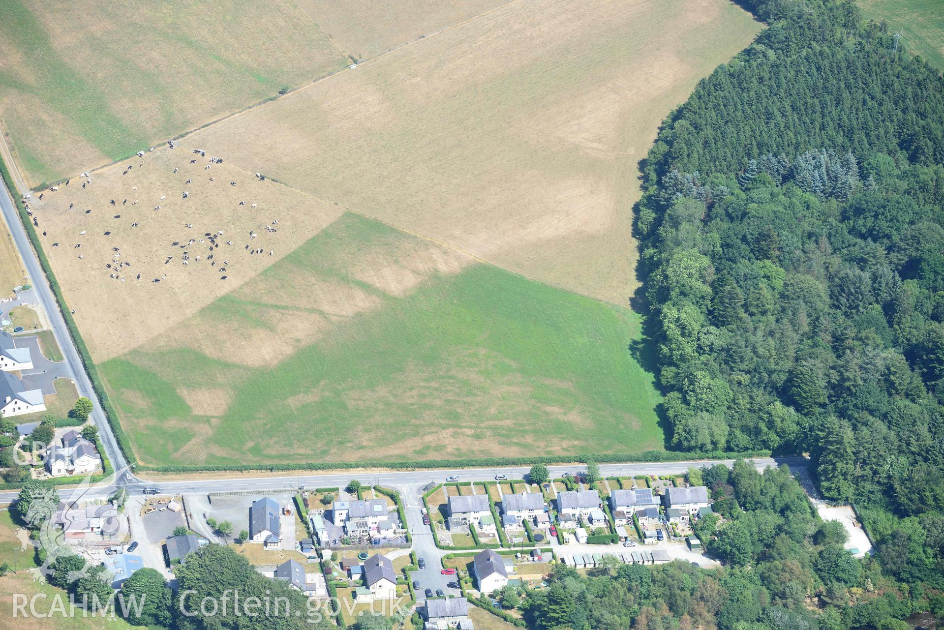 Abermagwr village cropmarks. Oblique aerial photograph taken during the Royal Commission’s programme of archaeological aerial reconnaissance by Toby Driver on 10 July 2018.