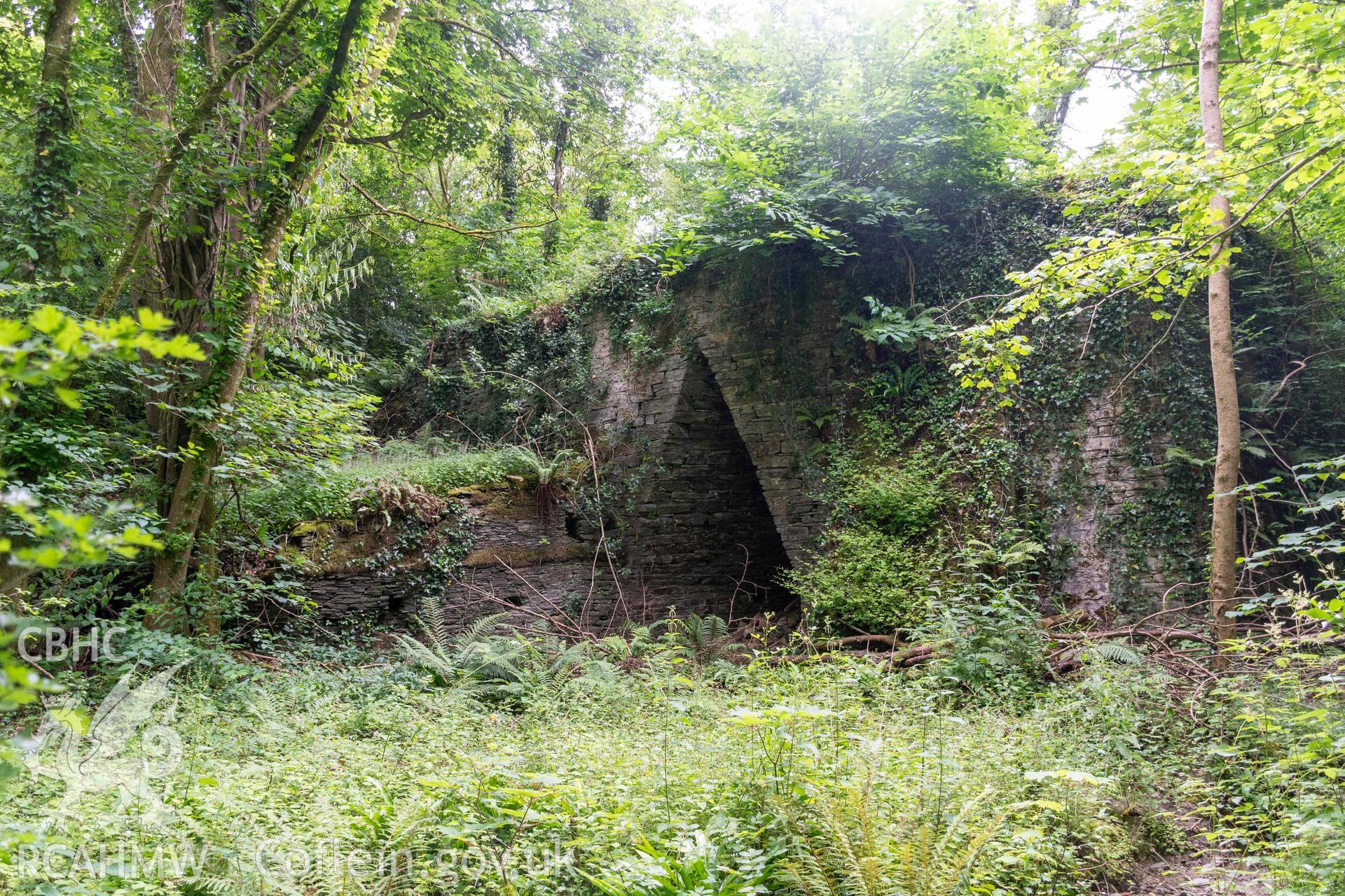 East face of kiln and lower retaining wall running to it.