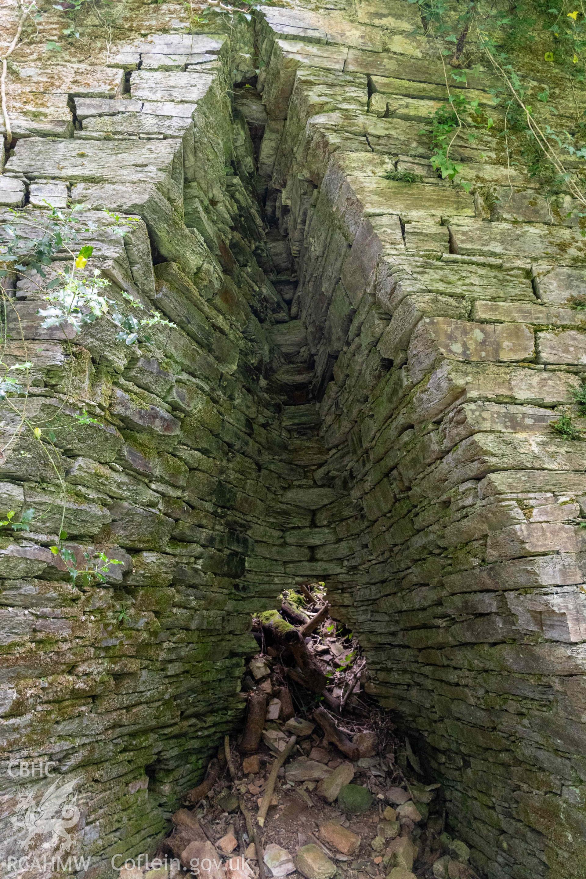 Back of kiln-eye and with collapse and hole into crucible on the east face.
