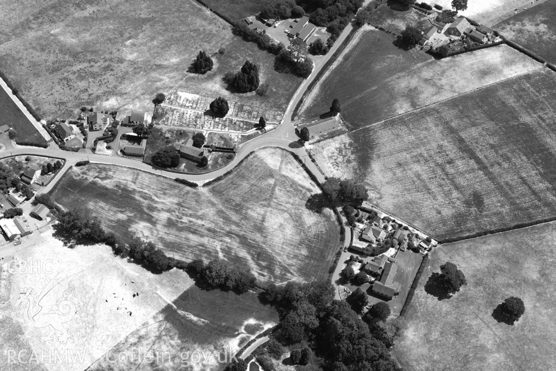 St Afan's Church and Llanafan rectangular enclosure. Oblique aerial photograph taken during the Royal Commission’s programme of archaeological aerial reconnaissance by Toby Driver on 10 July 2018.