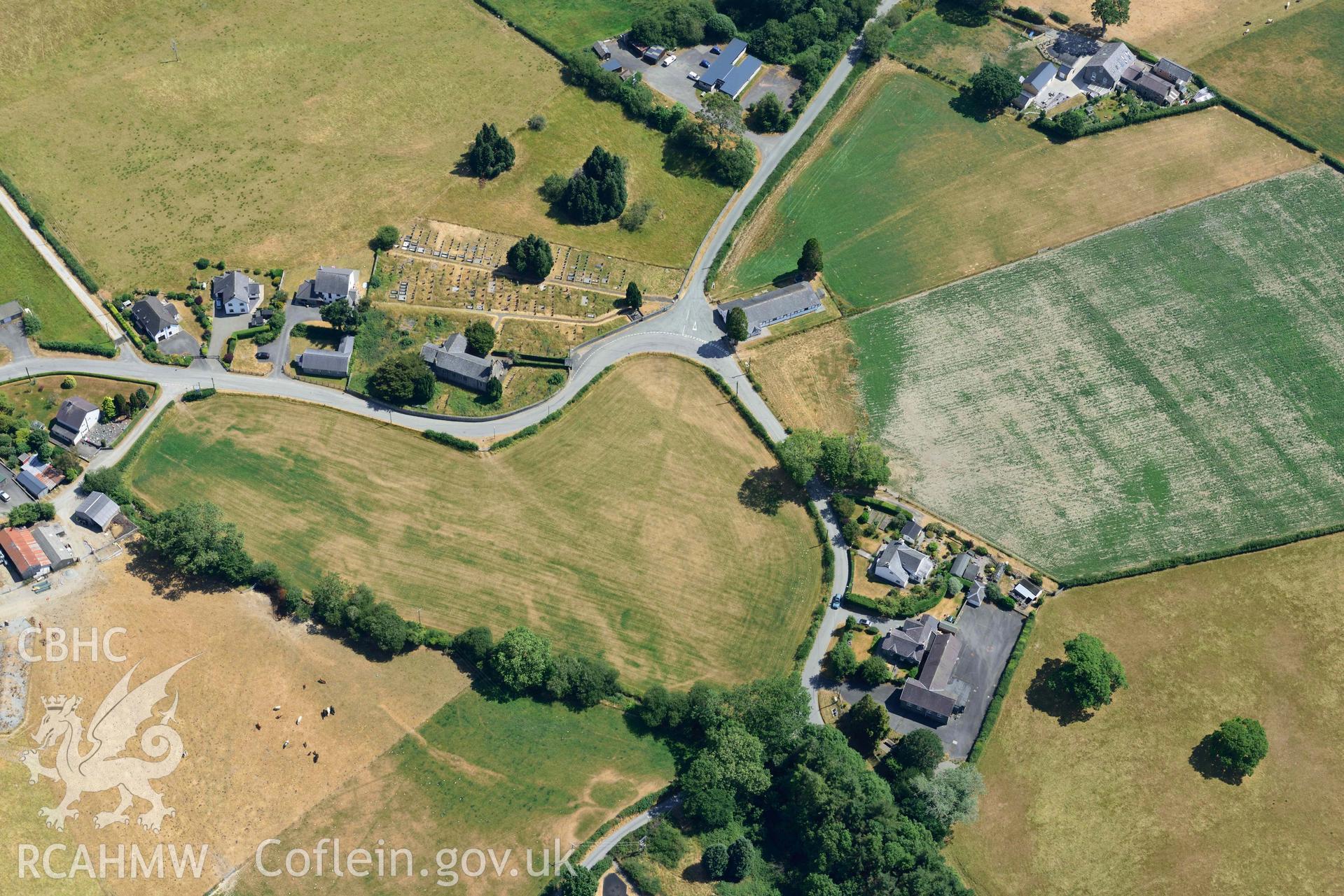 Close-up view of St Afan's Church and Llanafan rectangular enclosure. Oblique black and white aerial photograph taken during the Royal Commission’s programme of archaeological aerial reconnaissance by Toby Driver on 10 July 2018.