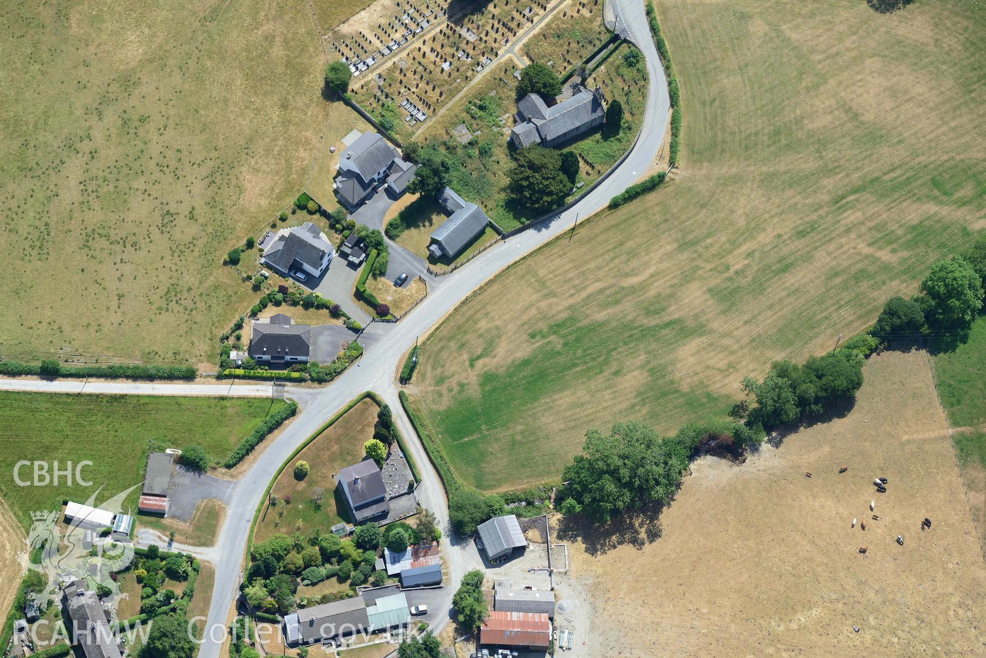 Close-up view of St Afan's Church and Llanafan rectangular enclosure. Oblique aerial photograph taken during the Royal Commission’s programme of archaeological aerial reconnaissance by Toby Driver on 10 July 2018.
