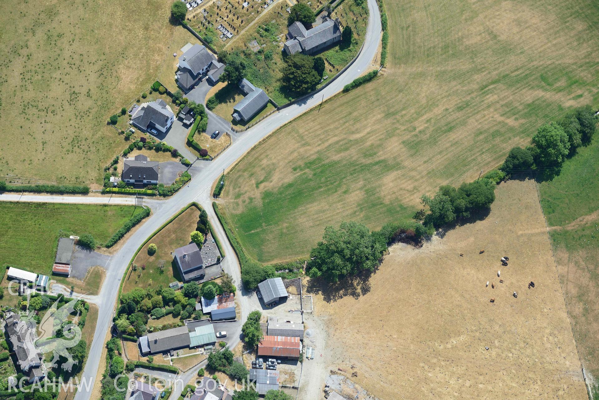 Detailed view of St Afan's Church and Llanafan rectangular enclosure. Oblique aerial photograph taken during the Royal Commission’s programme of archaeological aerial reconnaissance by Toby Driver on 10 July 2018.