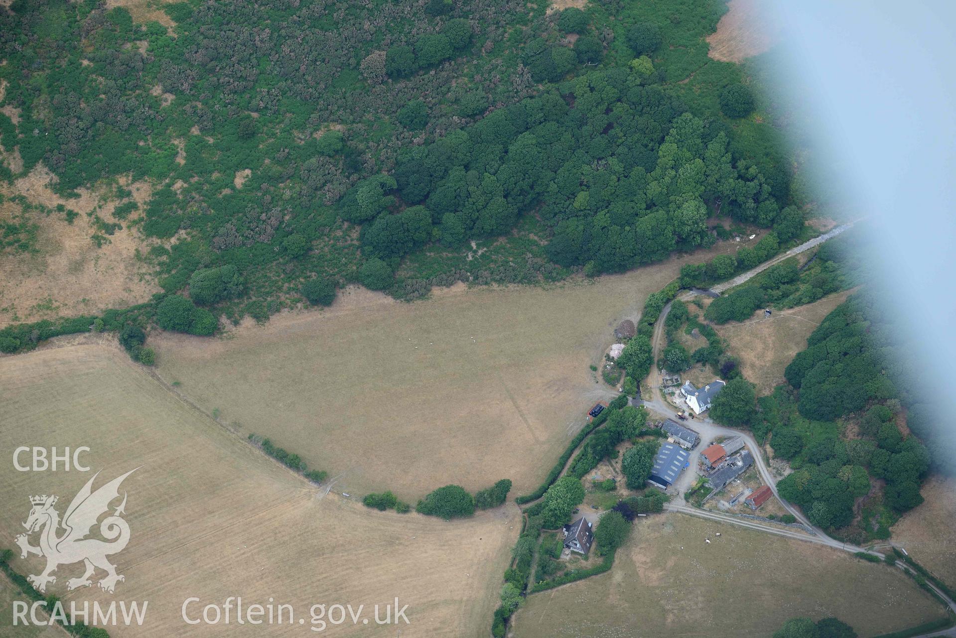 Bryn Dinas rectangular enclosure. Oblique aerial photograph taken during the Royal Commission’s programme of archaeological aerial reconnaissance by Toby Driver on 10 July 2018.