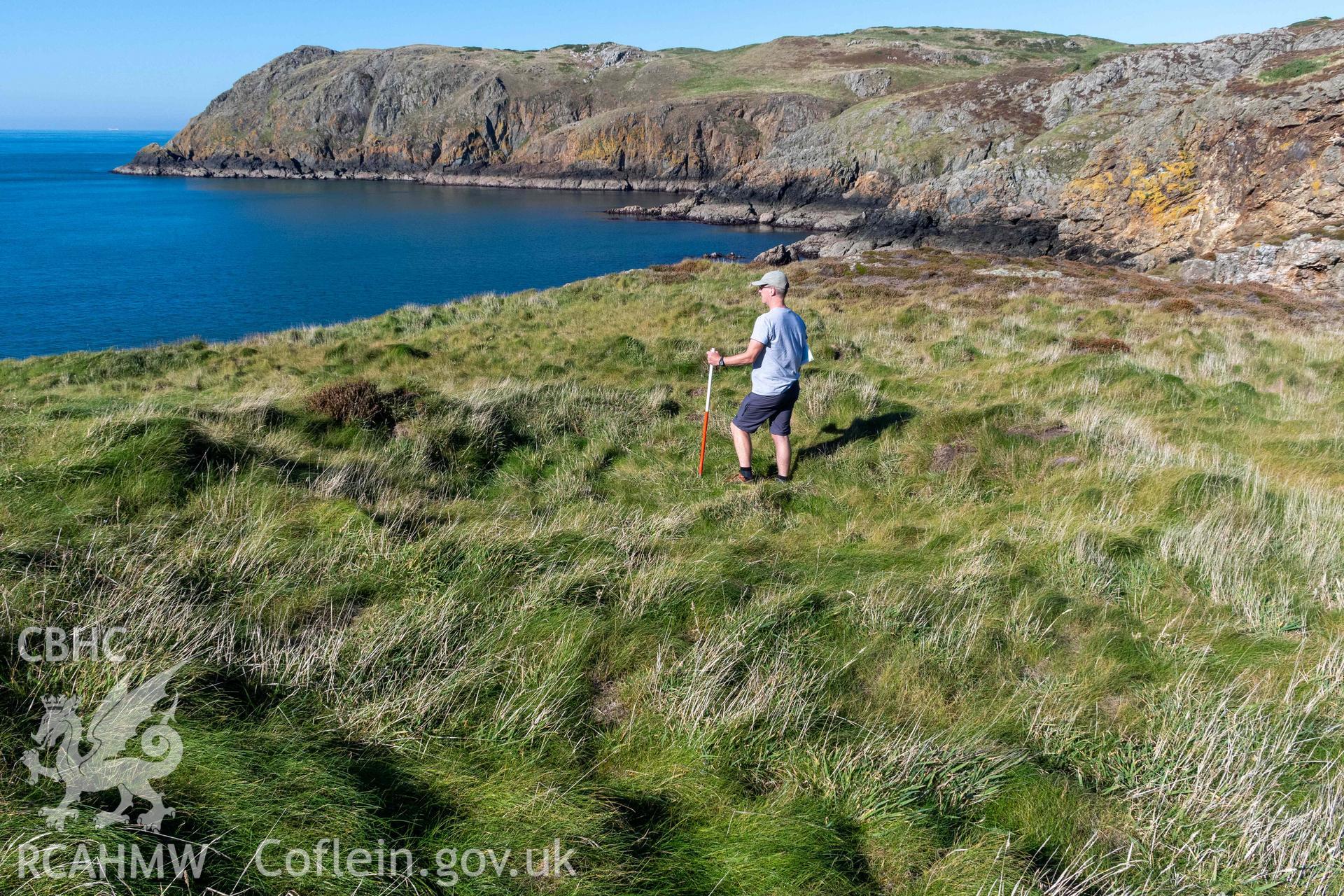 Ynys y Fydlyn Coastal Promontory Fort.  Roundhouse remain on western islet. View looking north east with scale.