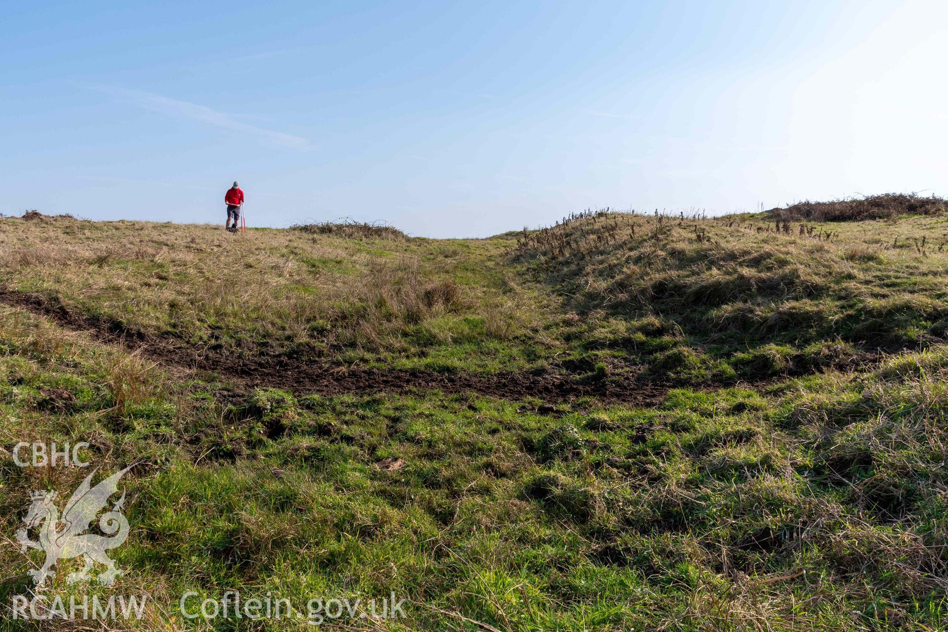 Twyn y Parc Coastal Promontory Fort. View east along outer bank and ditch (with scale).