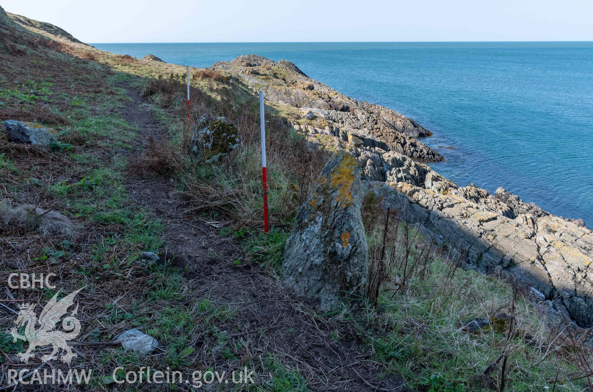 Twyn y Parc Coastal Promontory Fort. Orthostat walling of terraced trackway along the northern side of fort adjacent to Porth Fain (with scale).