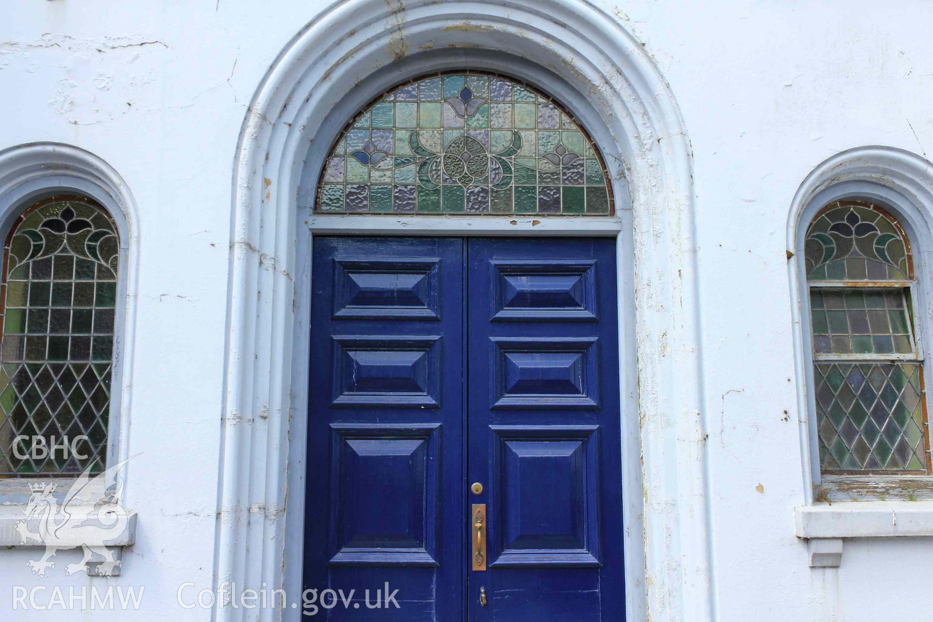 Exterior dront door with round-headed windows either side. Tabernacl Cardigan