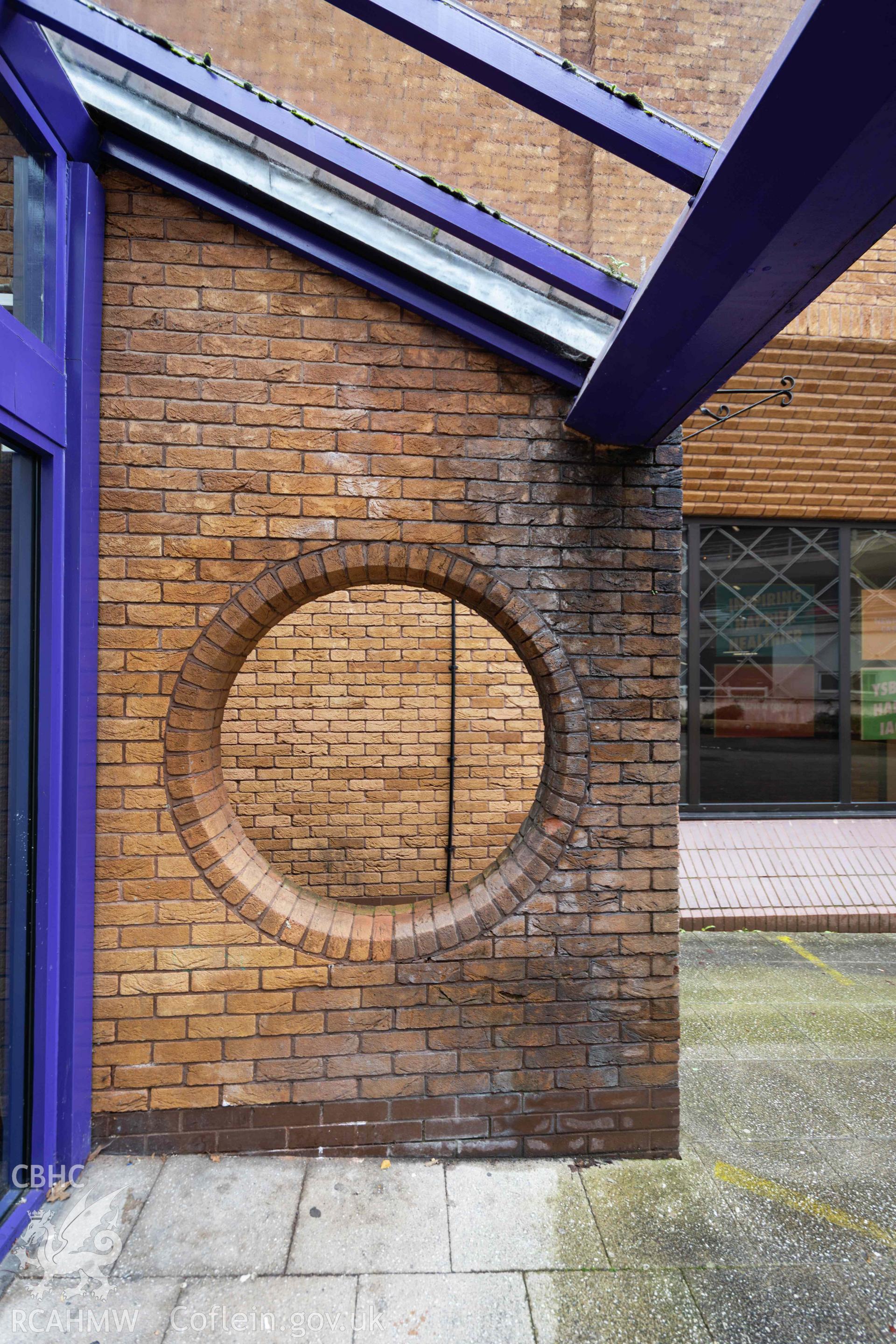 Round brickwork window at main (west) entrance. Newport Centre