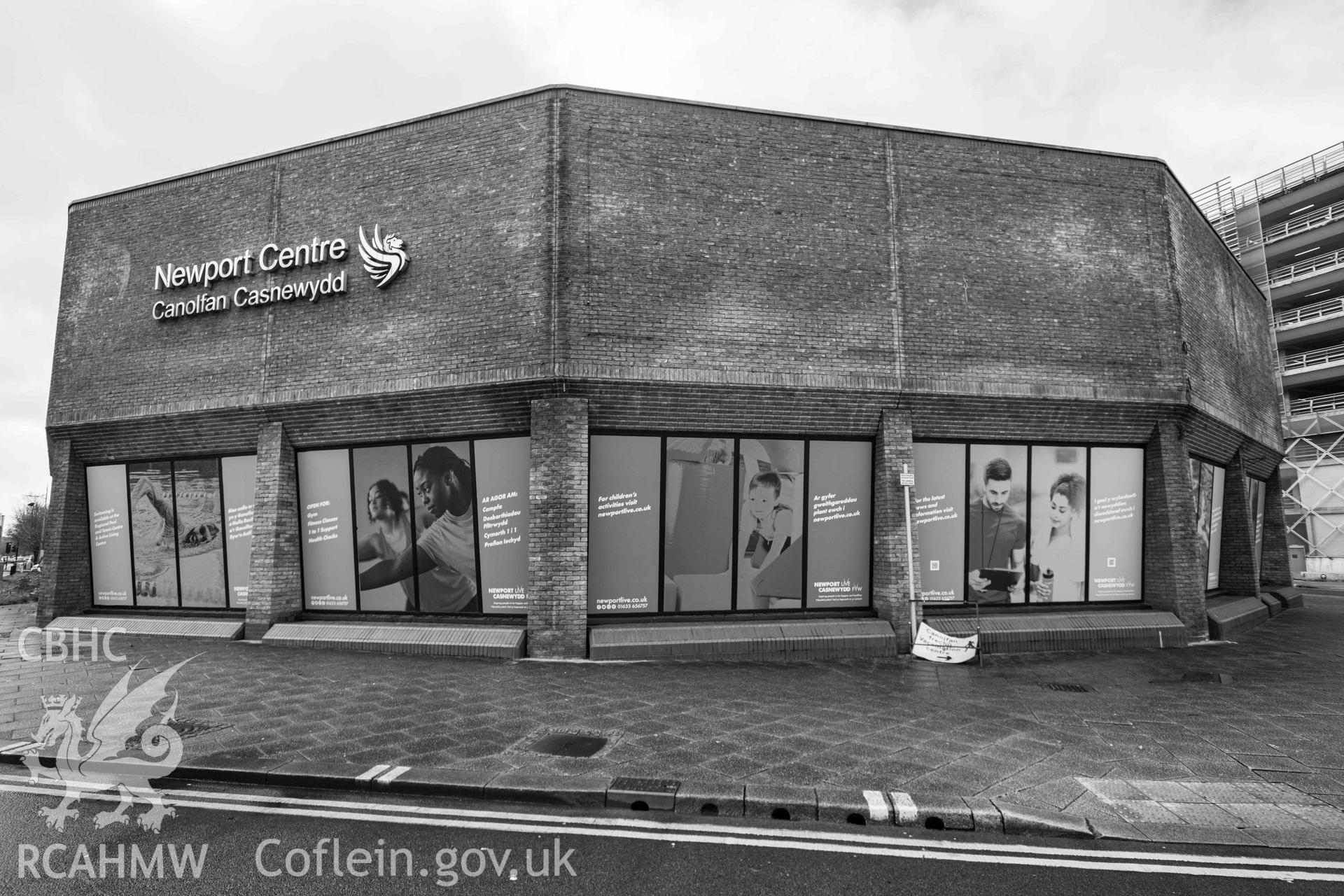 Exterior - north end of Newport Centre with signage. Dodecagon shaped swimming pool / water park. Black and white. Newport Centre.
