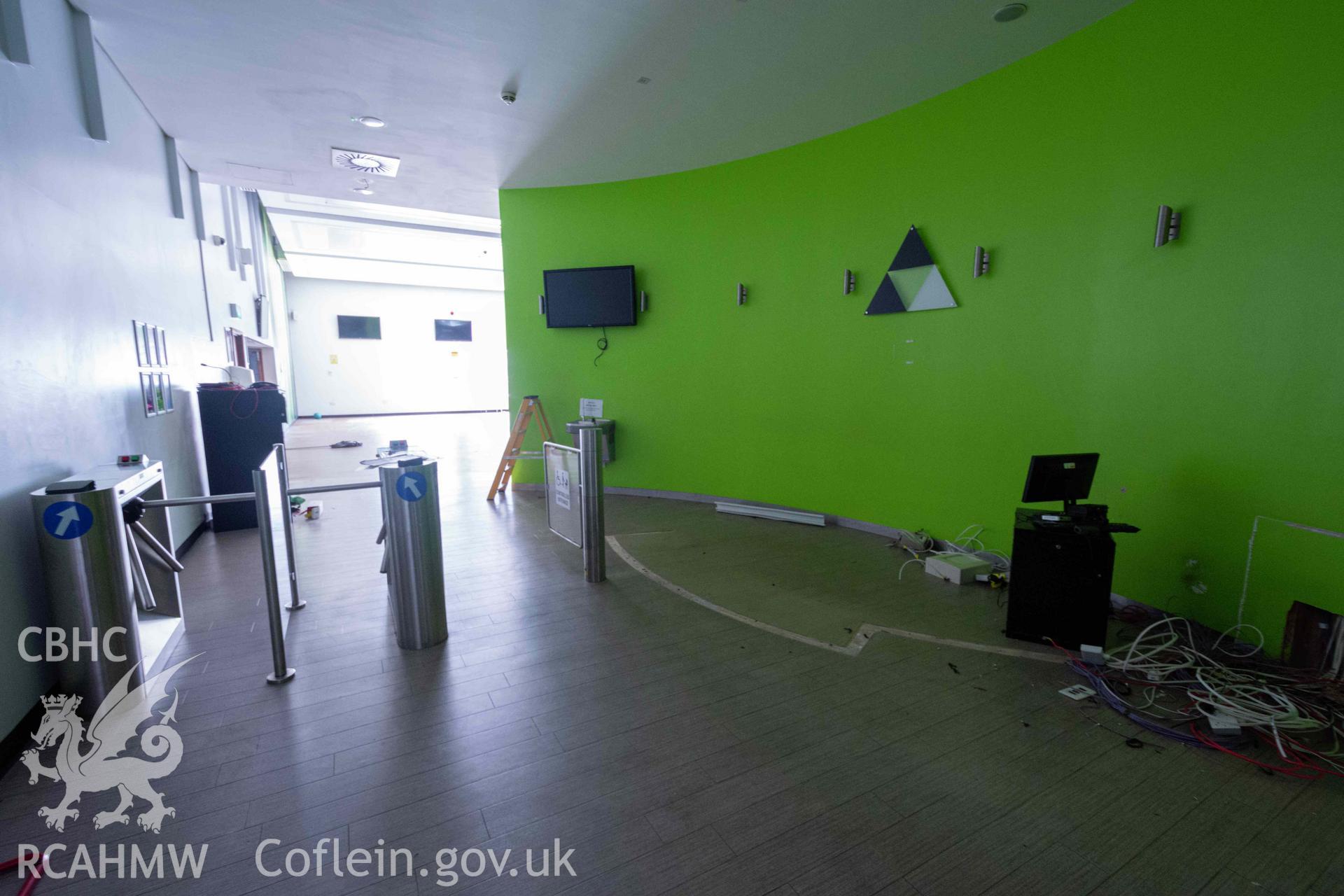 Turnstiles to open space south room. First floor. Newport Centre