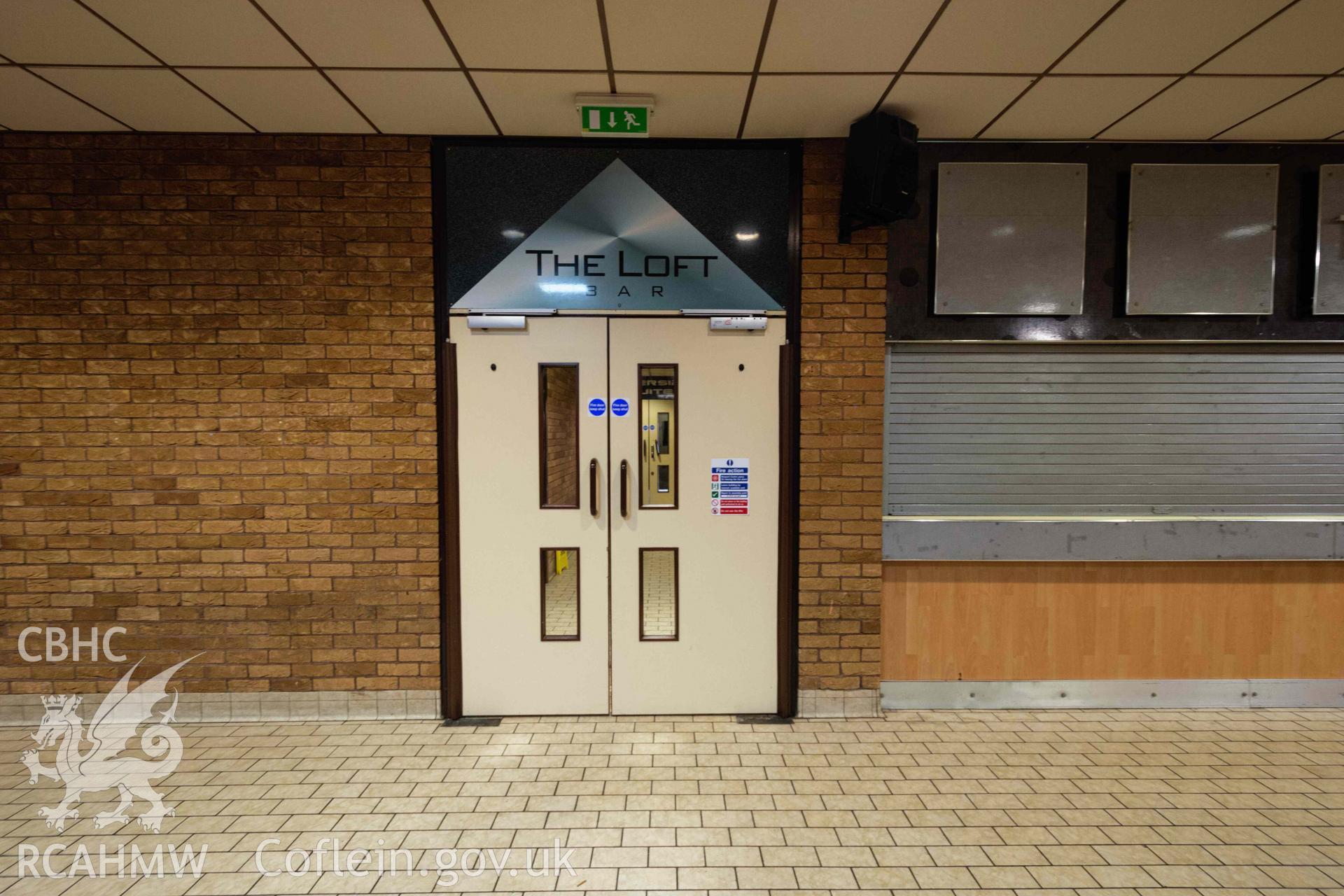 Doors next to the 'Loft' bar. First floor, overlooking swimming pool and water park. Newport Centre