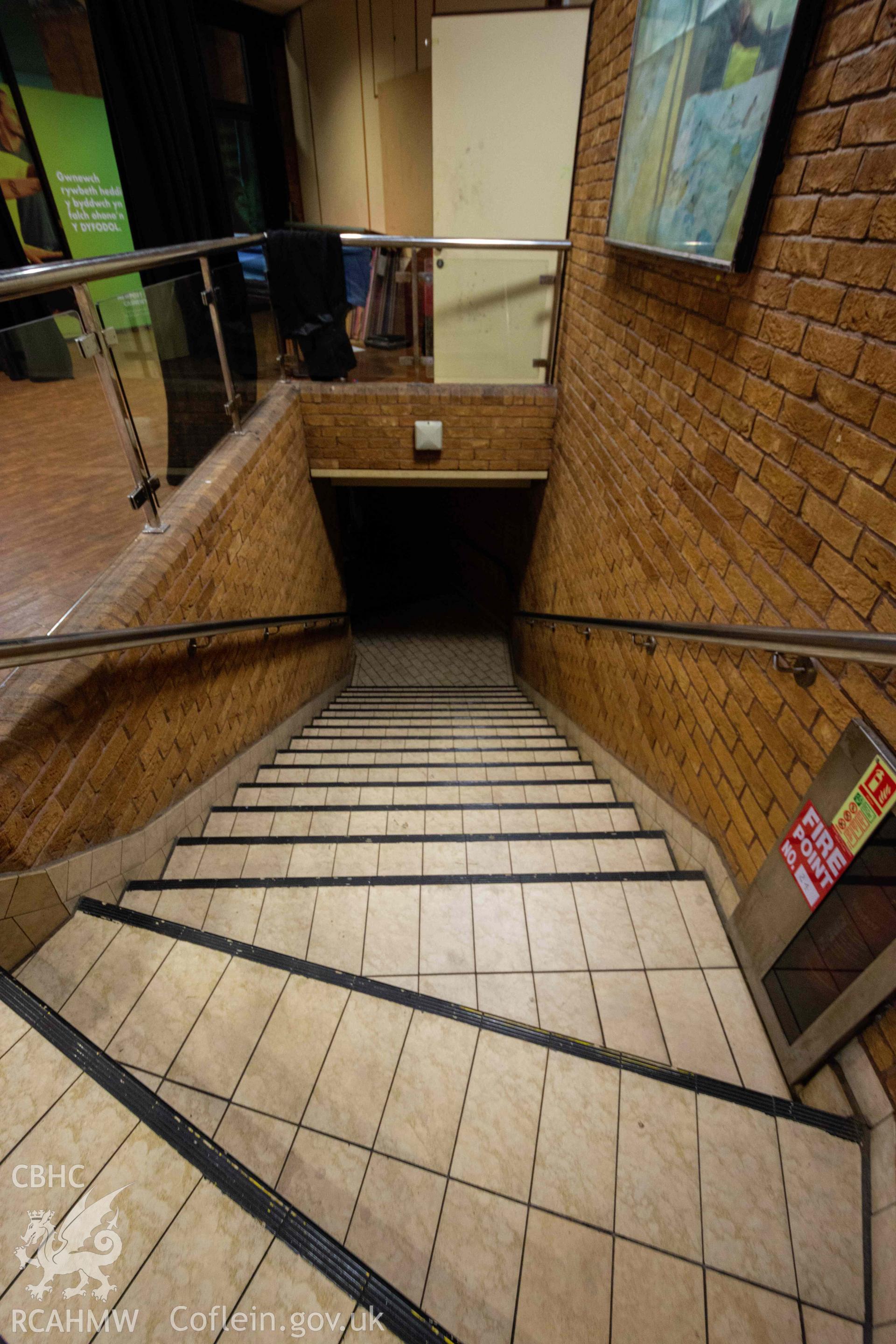 Stairs down from the 'Loft'. First floor, overlooking swimming pool and water park. Portrait orientation. Newport Centre