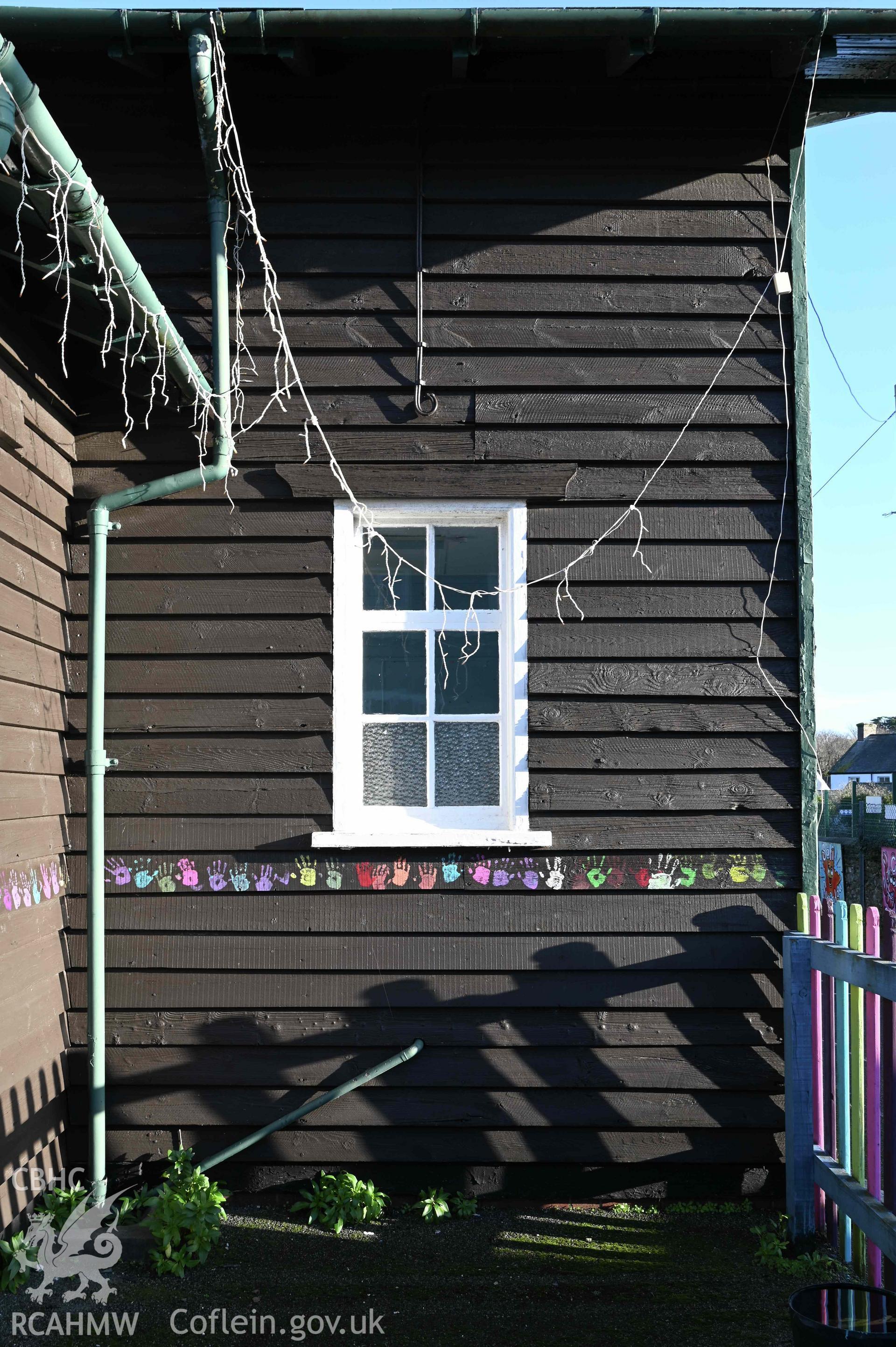 Right hand bay of façade of Ysgol Abersoch decorated with pupils handprints
