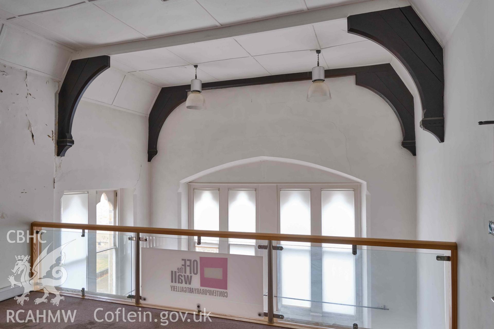 Photograph showing mezzanine (1.1) and clerk's office (G3) ceiling looking SE, from a Level 3 Historic Building Record for The Old Probate Registry, Llandaff, Cardiff. Prepared by Holland Heritage in 2024 as a condition of listed planning consent.