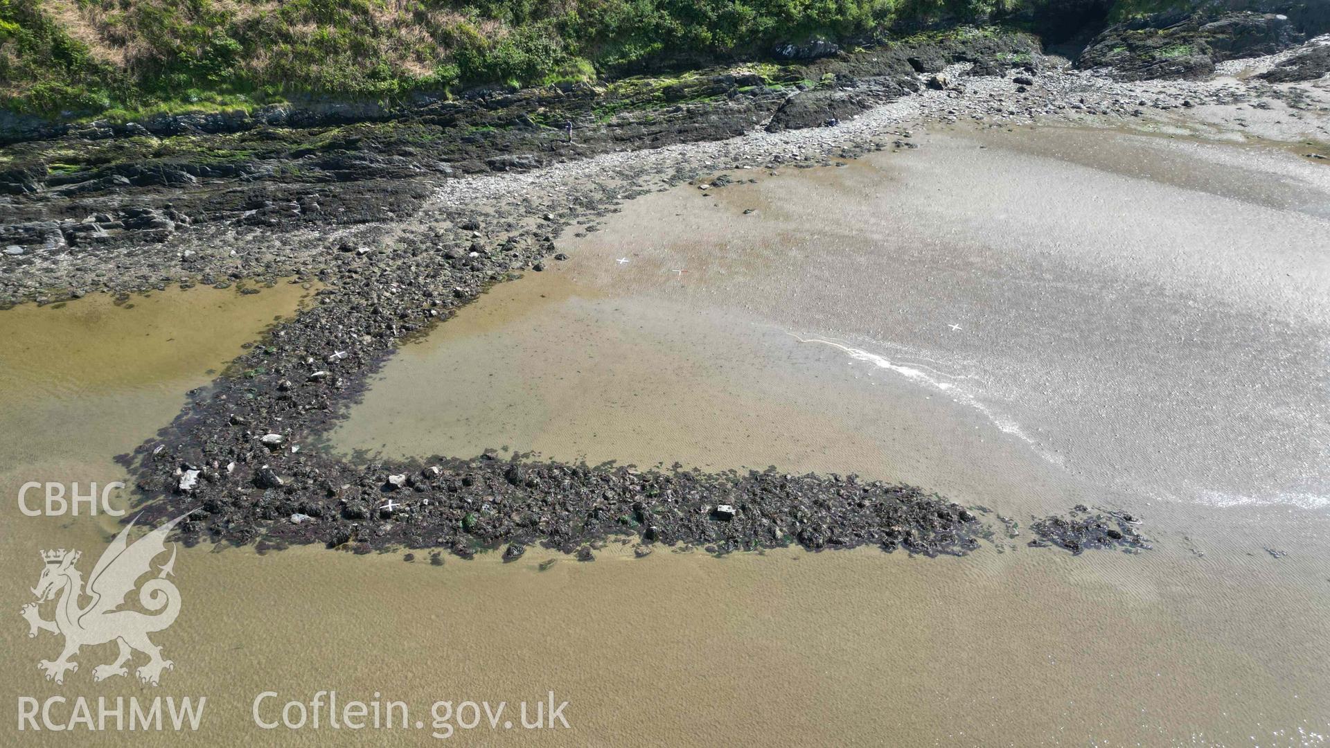 Oblique view, looking south, of Goodwick Fish Trap 2 at low tide on 09/05/2024. Scales are 1m.