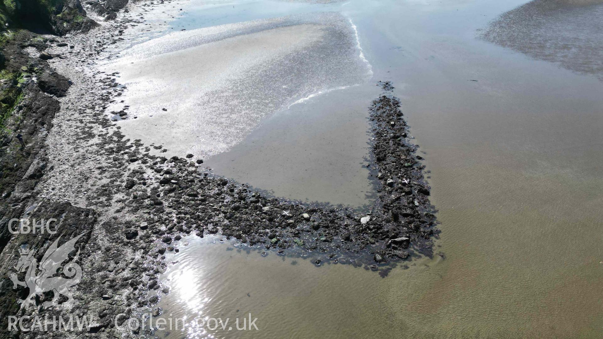 Oblique view, looking west, of Goodwick Fish Trap 2 at low tide on 09/05/2024. Scales are 1m.