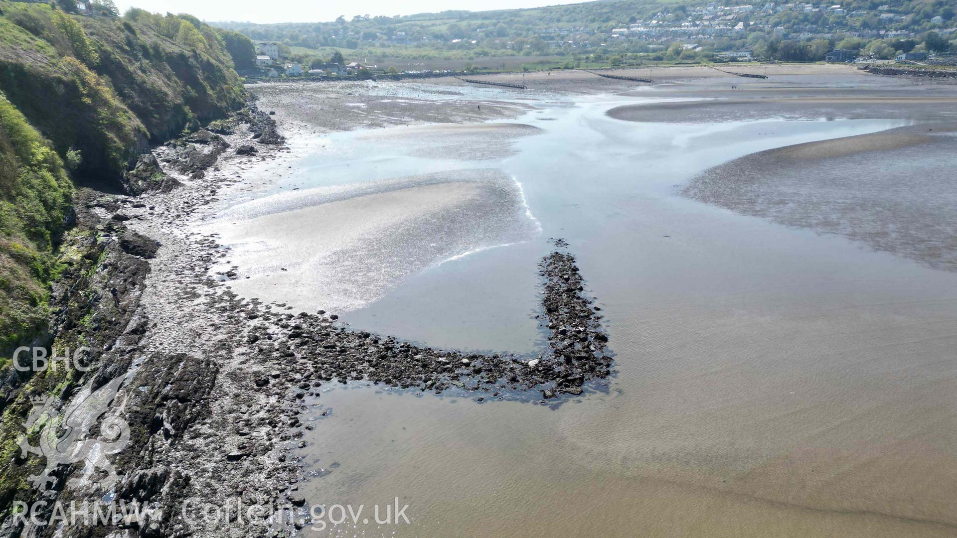 Oblique view, looking west, of Goodwick Fish Trap 2 at low tide on 09/05/2024. The rest of the exposed foreshore is visible in the background.