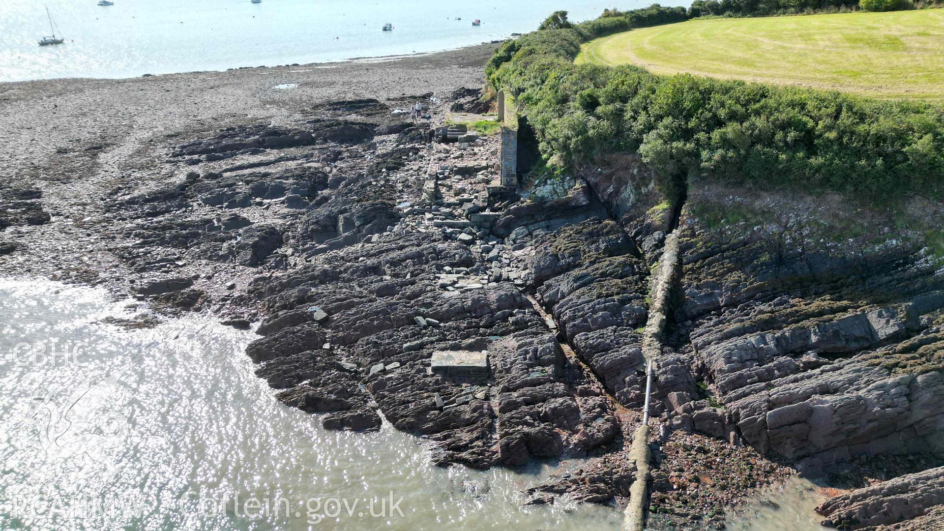 Oblique view of the Old Lifeboat Station at Angle looking south on 19/09/2024. Scales are 1m.