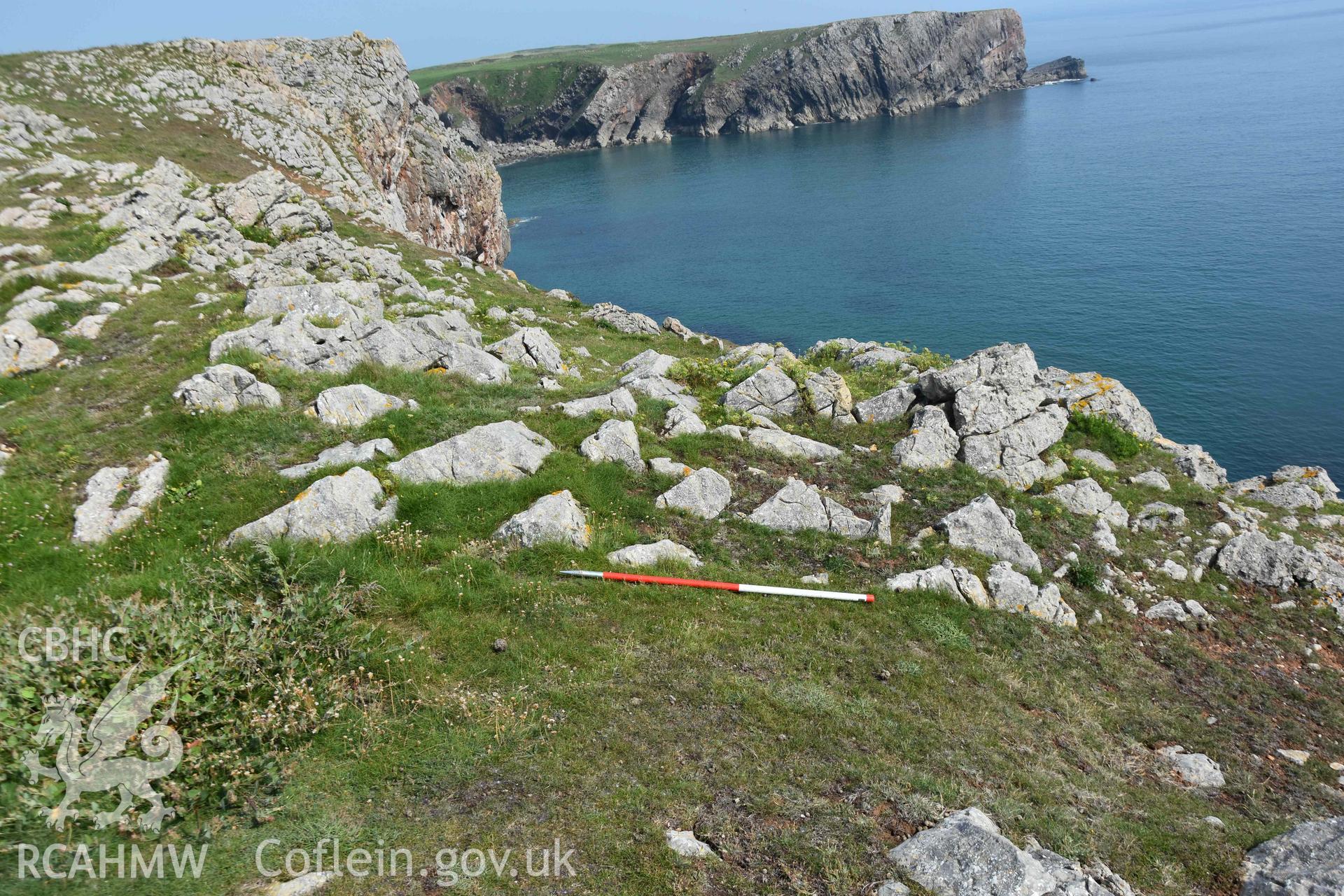 Crocksydam Camp. Western end of defences, cutting through exposed limestone.