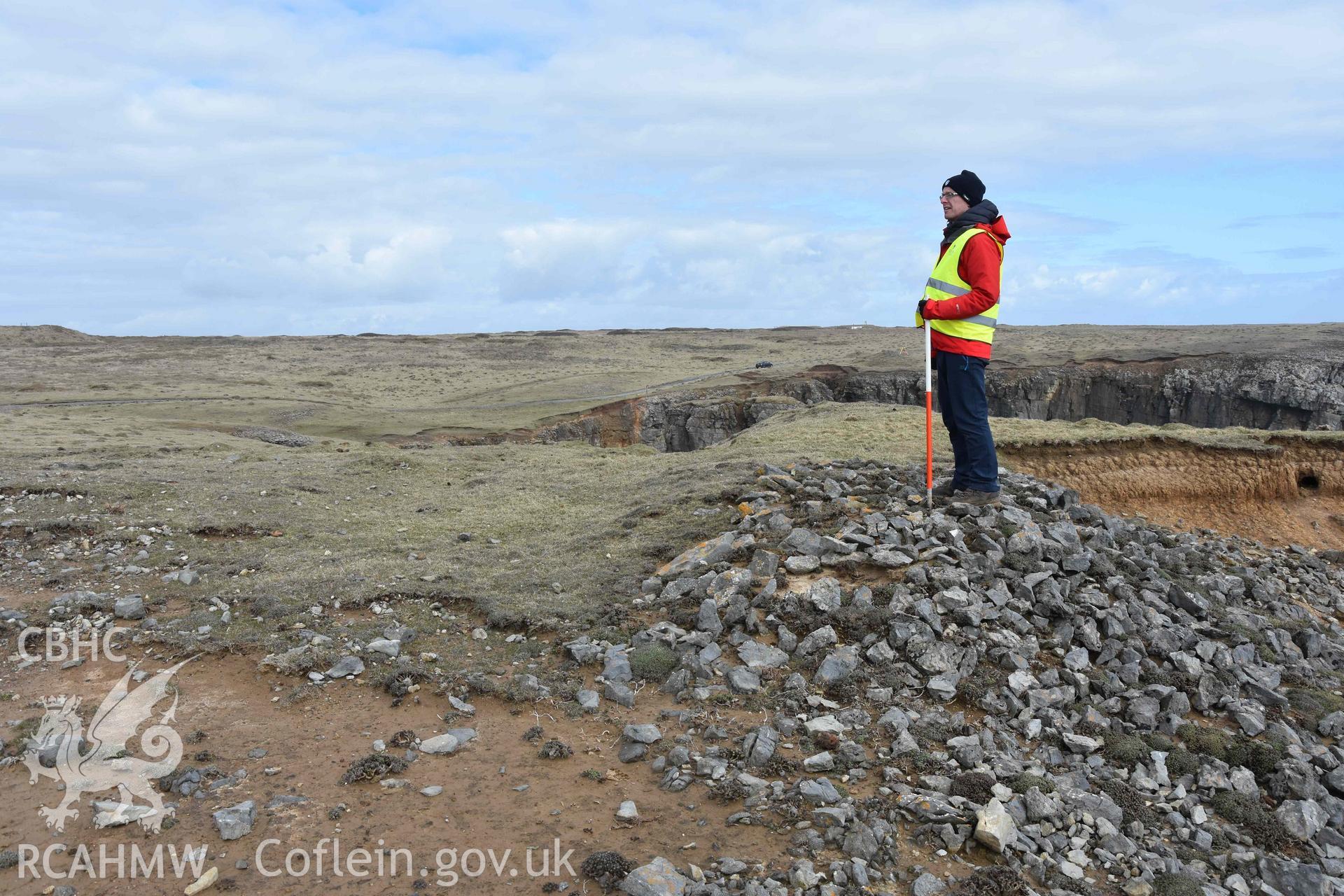 Linney Head Promontory Enclosure 27 March 2018.  Enclosure bank with walling exposed at west end.