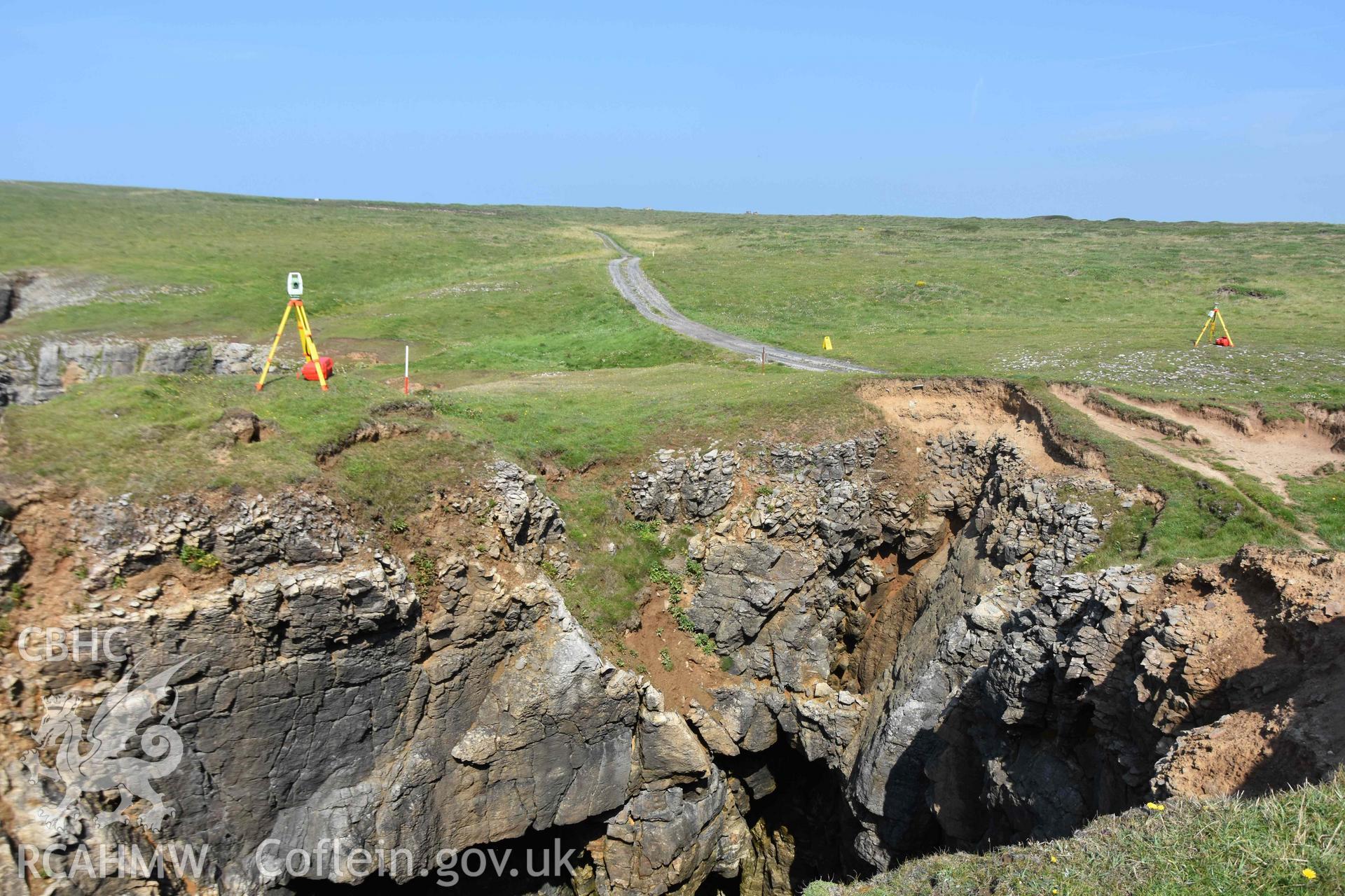 Linney Head Camp. Remains exposed on small tongue of rock detached from promontory on west side.