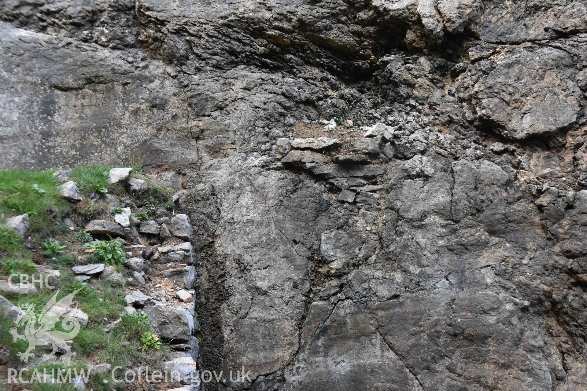 Quay wall, east end with feature in quarry face..