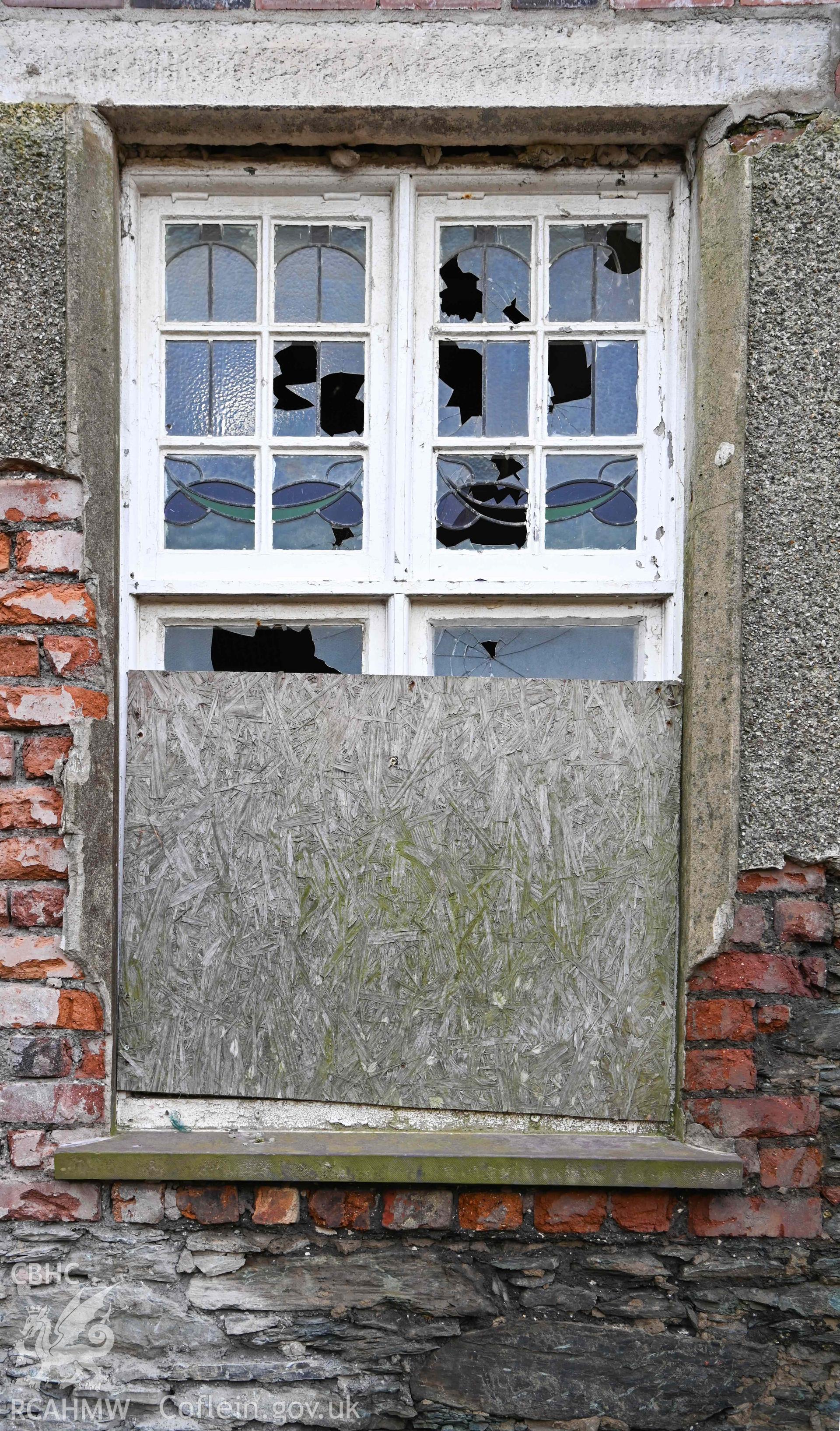 Carmel Welsh Independent Chapel - Detail of a shattered and boarded up window, taken from the East