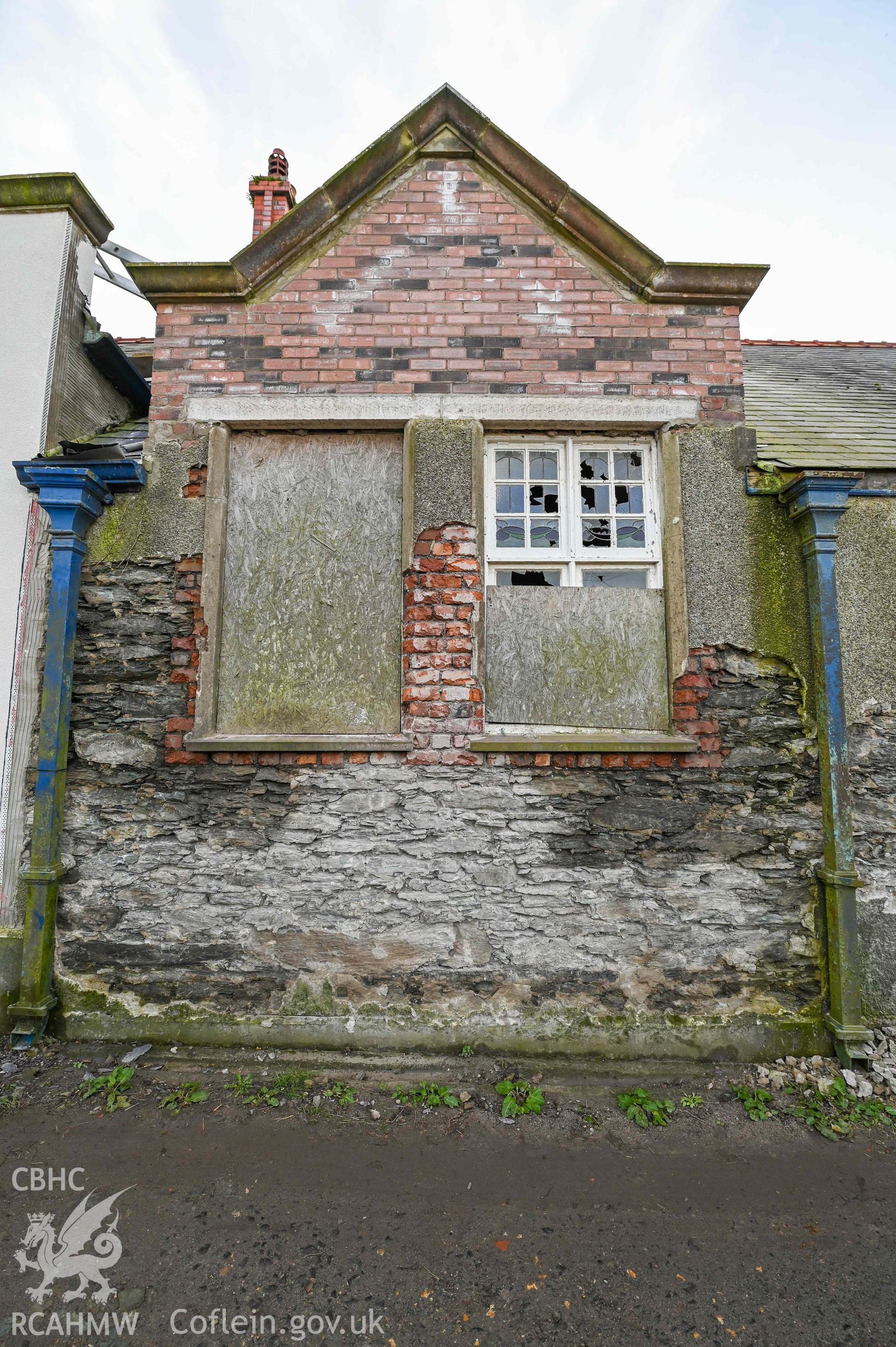 Carmel Welsh Independent Chapel - View of shattered and boarded up windows on side of building, taken from North-East