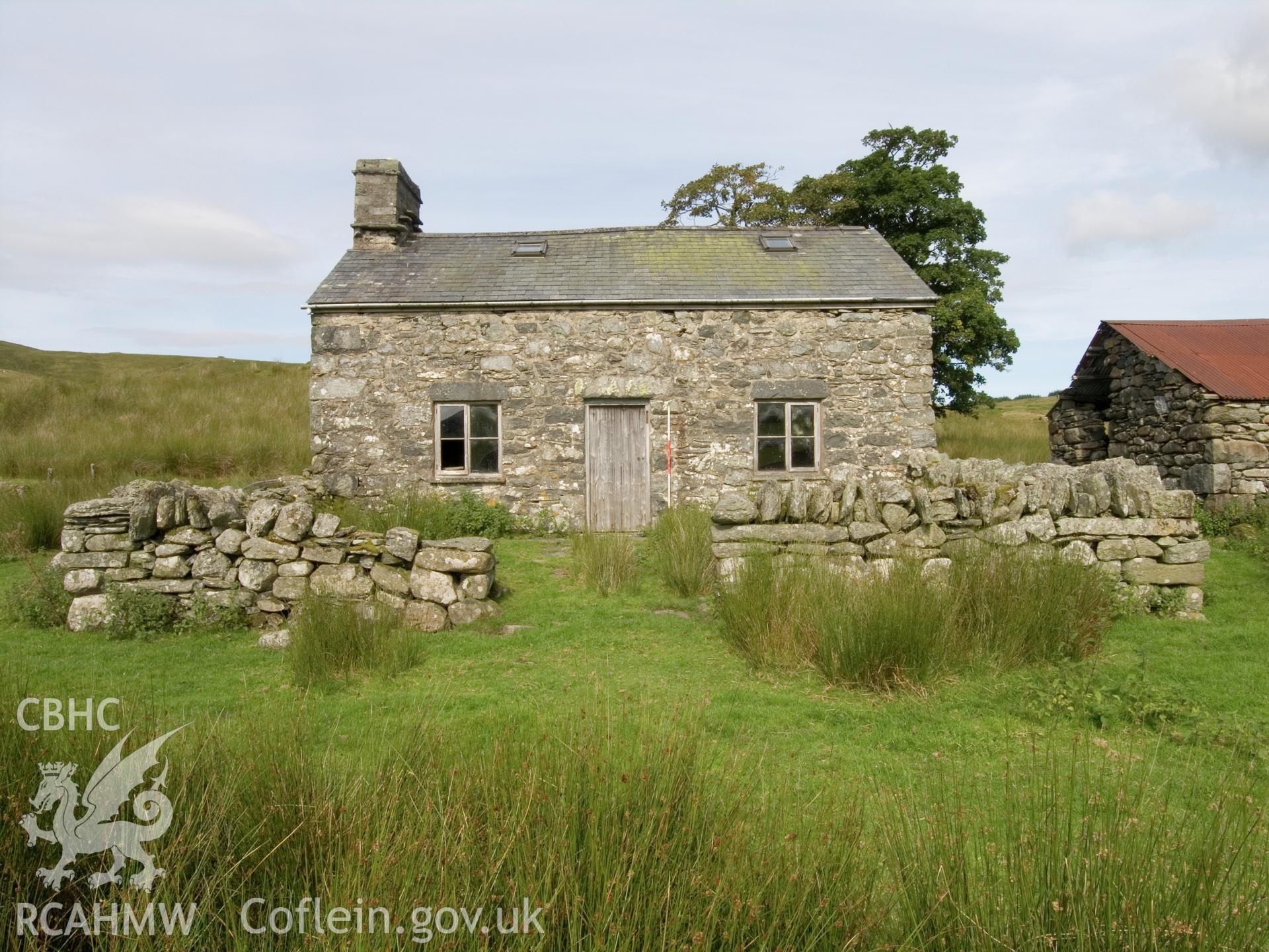 View looking N showing front of house and garden walls.