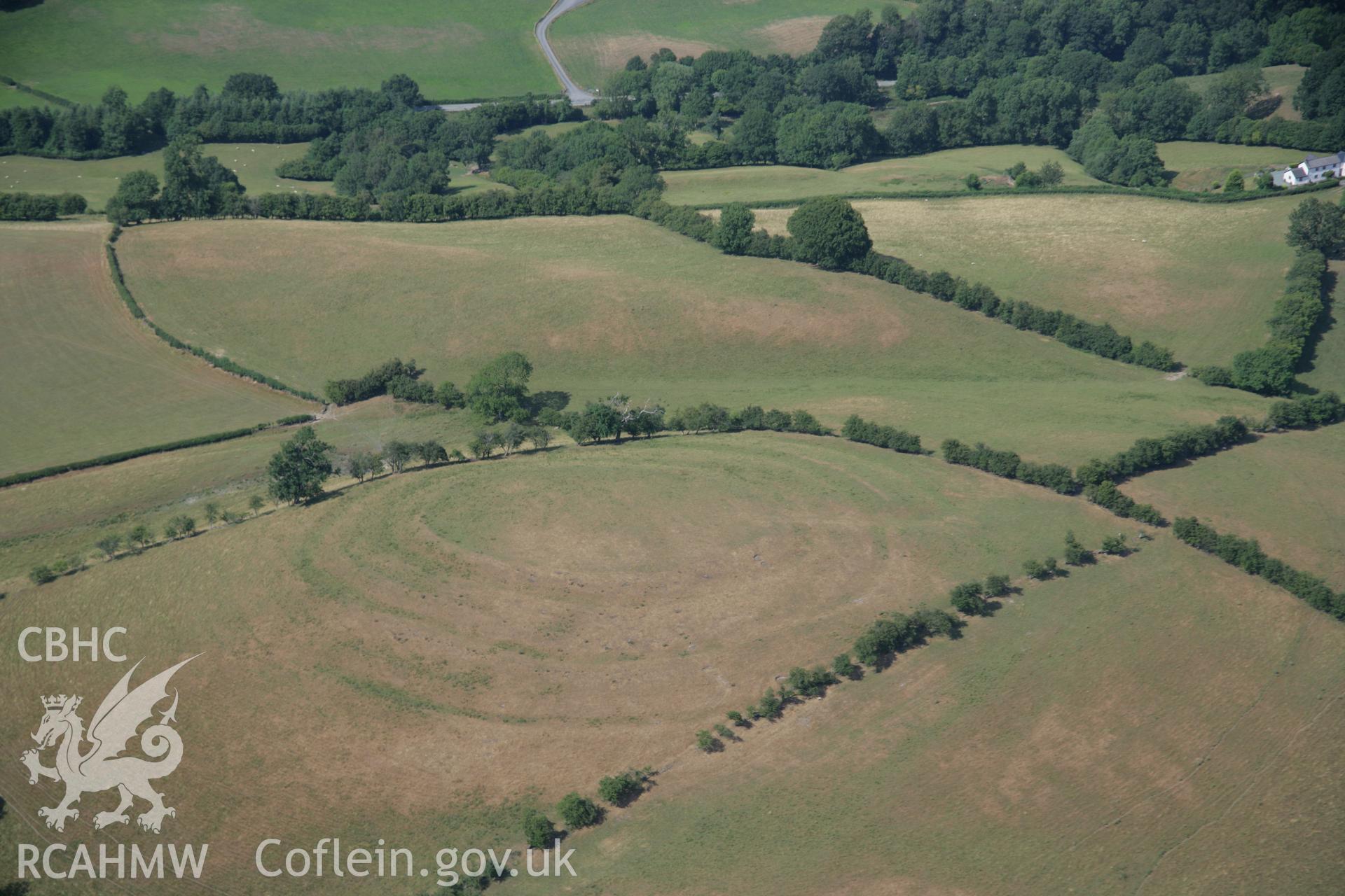 RCAHMW colour oblique aerial photograph of Pentre Camp, Pen-y-Gorddin Defended Enclosure. Taken on 25 July 2006 by Toby Driver.