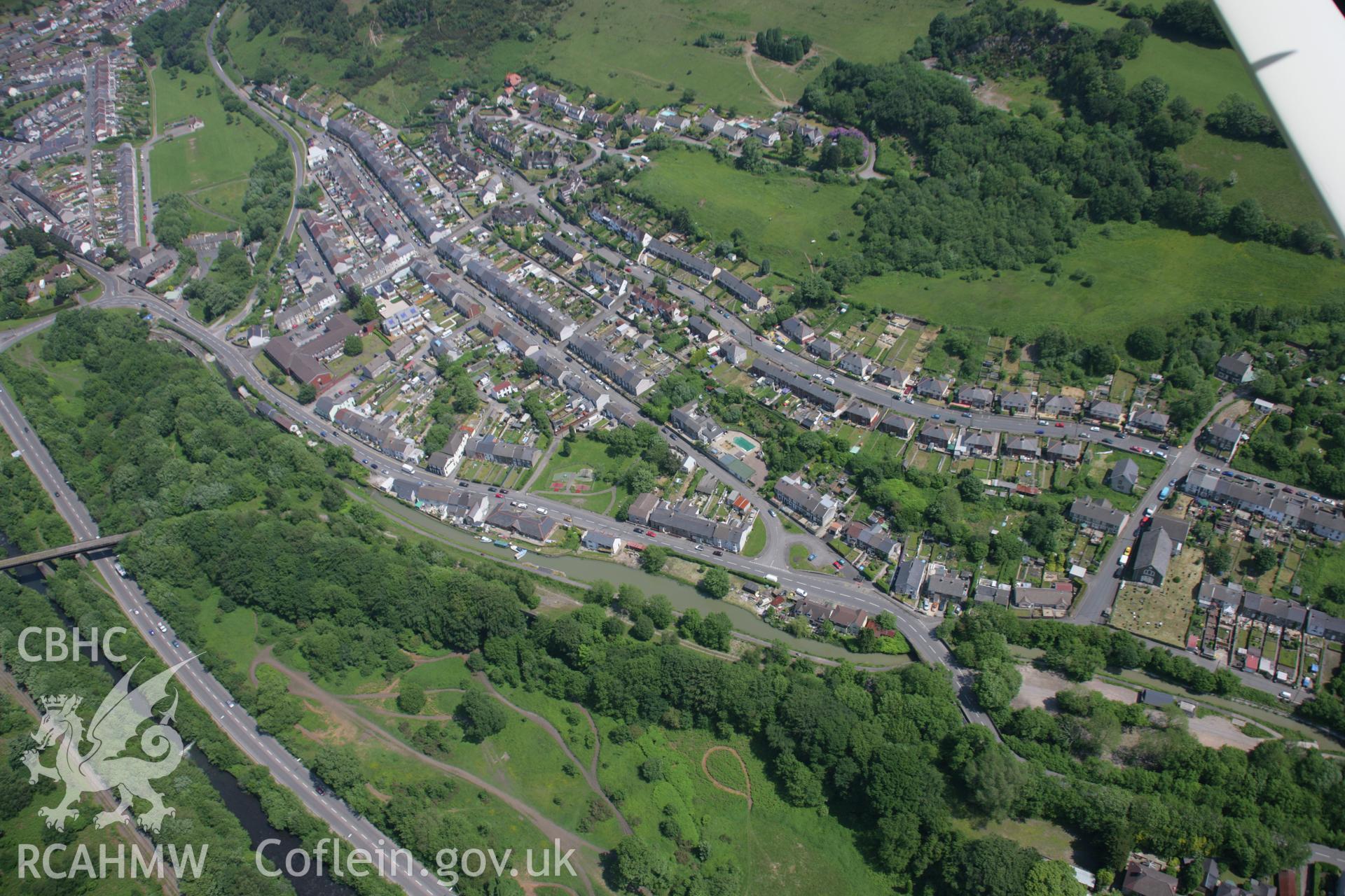RCAHMW colour oblique aerial photograph of Pont-y-Waun in general view looking towards the north-east from Trinity Chapel. Taken on 09 June 2006 by Toby Driver