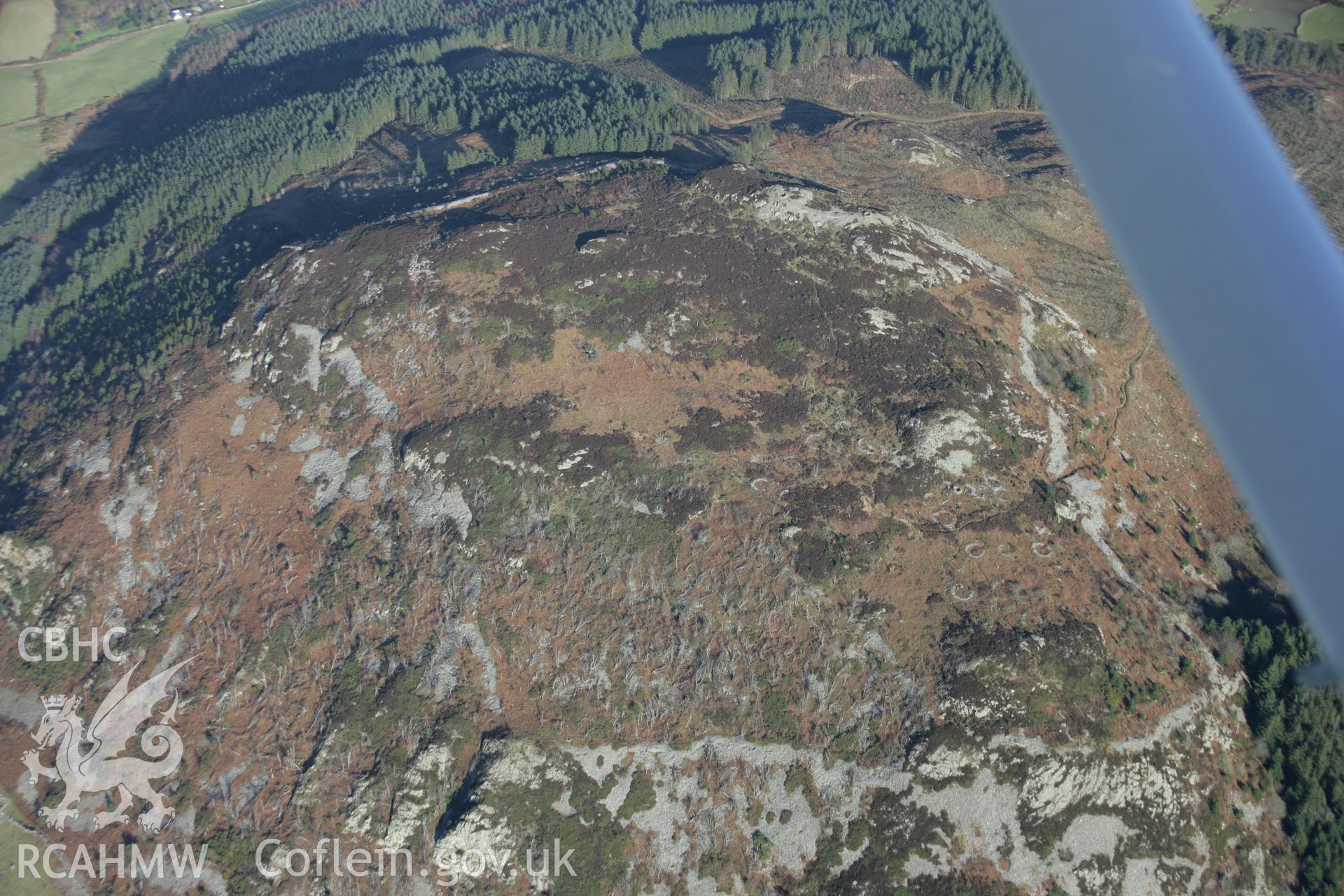 RCAHMW colour oblique aerial photograph of Garn Boduan from the west. Taken on 09 February 2006 by Toby Driver.