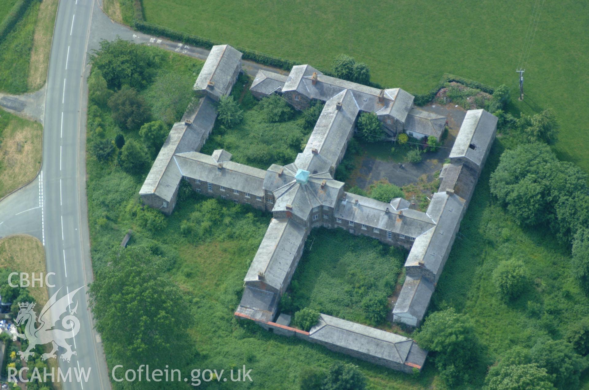 RCAHMW colour oblique aerial photograph of Llanfyllin Union Workhouse, Llanfyllin taken on 08/06/2004 by Toby Driver