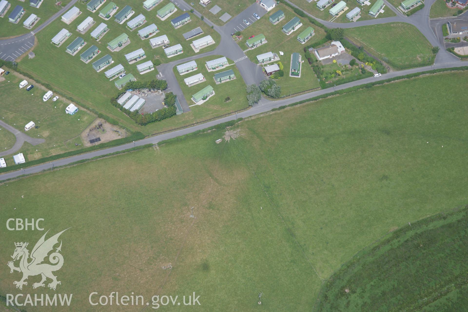 RCAHMW colour oblique aerial photograph of Glan-y-Mor Enclosure. Taken on 04 July 2006 by Toby Driver.
