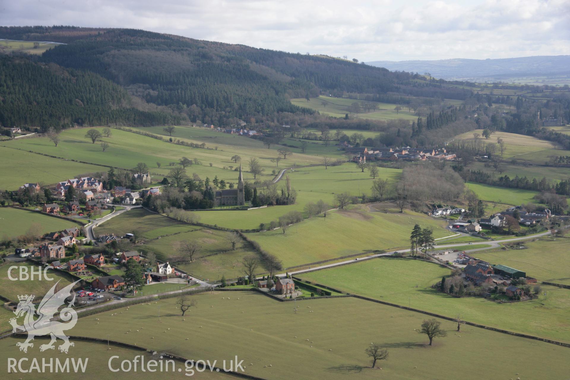 RCAHMW colour oblique aerial photograph of Holy Trinity Church, Leighton, general viewed from north-west. Taken on 06 March 2006 by Toby Driver.