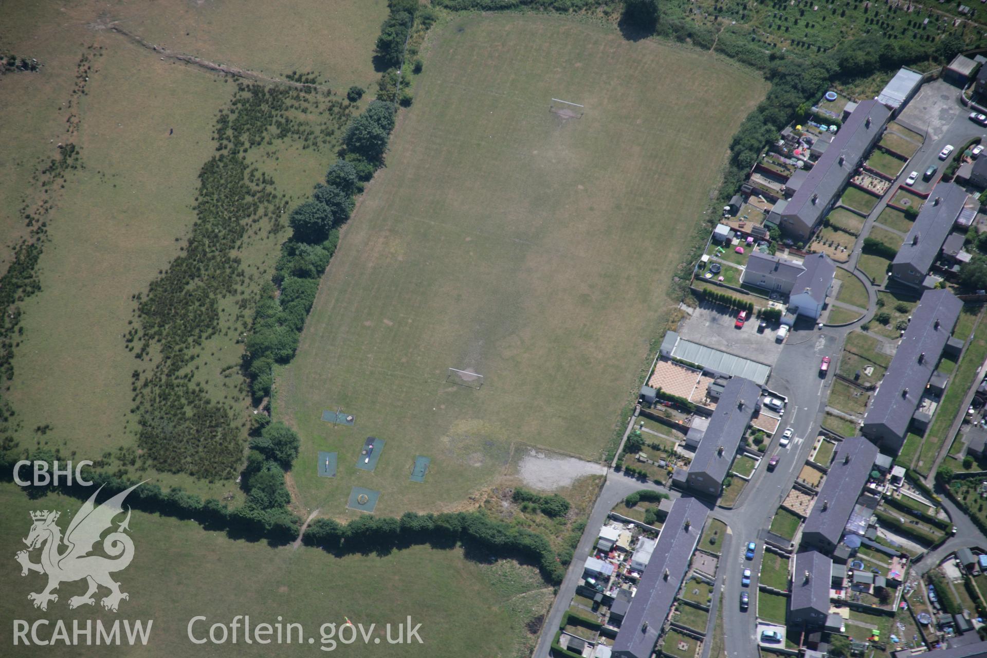 RCAHMW colour oblique aerial photograph of the Tyddyn Pandy Square Barrow Cemetery. Taken on 25 July 2006 by Toby Driver.