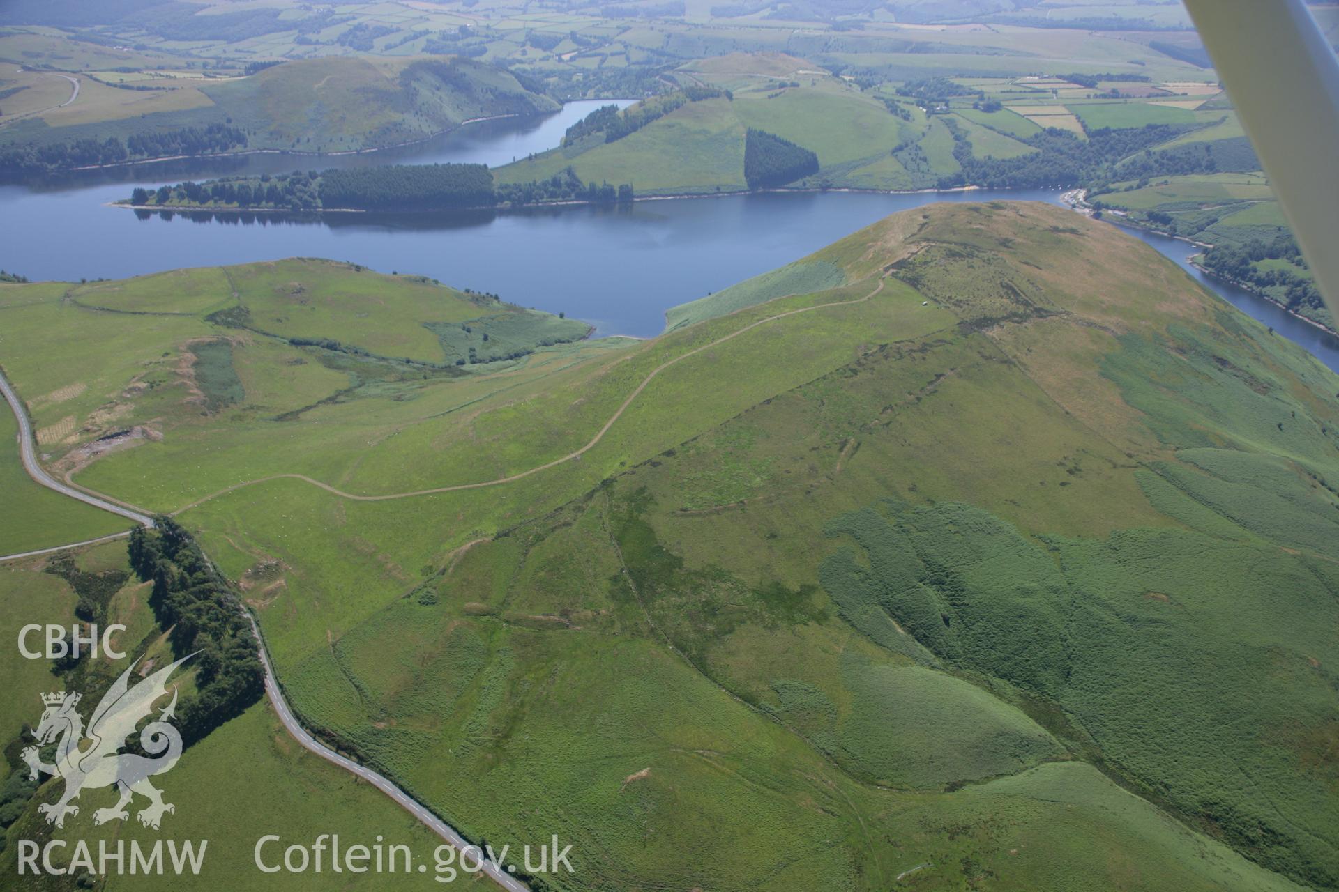 RCAHMW colour oblique aerial photograph of Dinas, Trefeglwys. Taken on 17 July 2006 by Toby Driver.