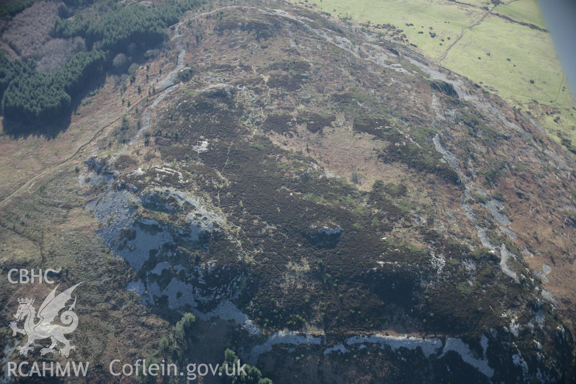 RCAHMW colour oblique aerial photograph of Garn Boduan from the north. Taken on 09 February 2006 by Toby Driver.