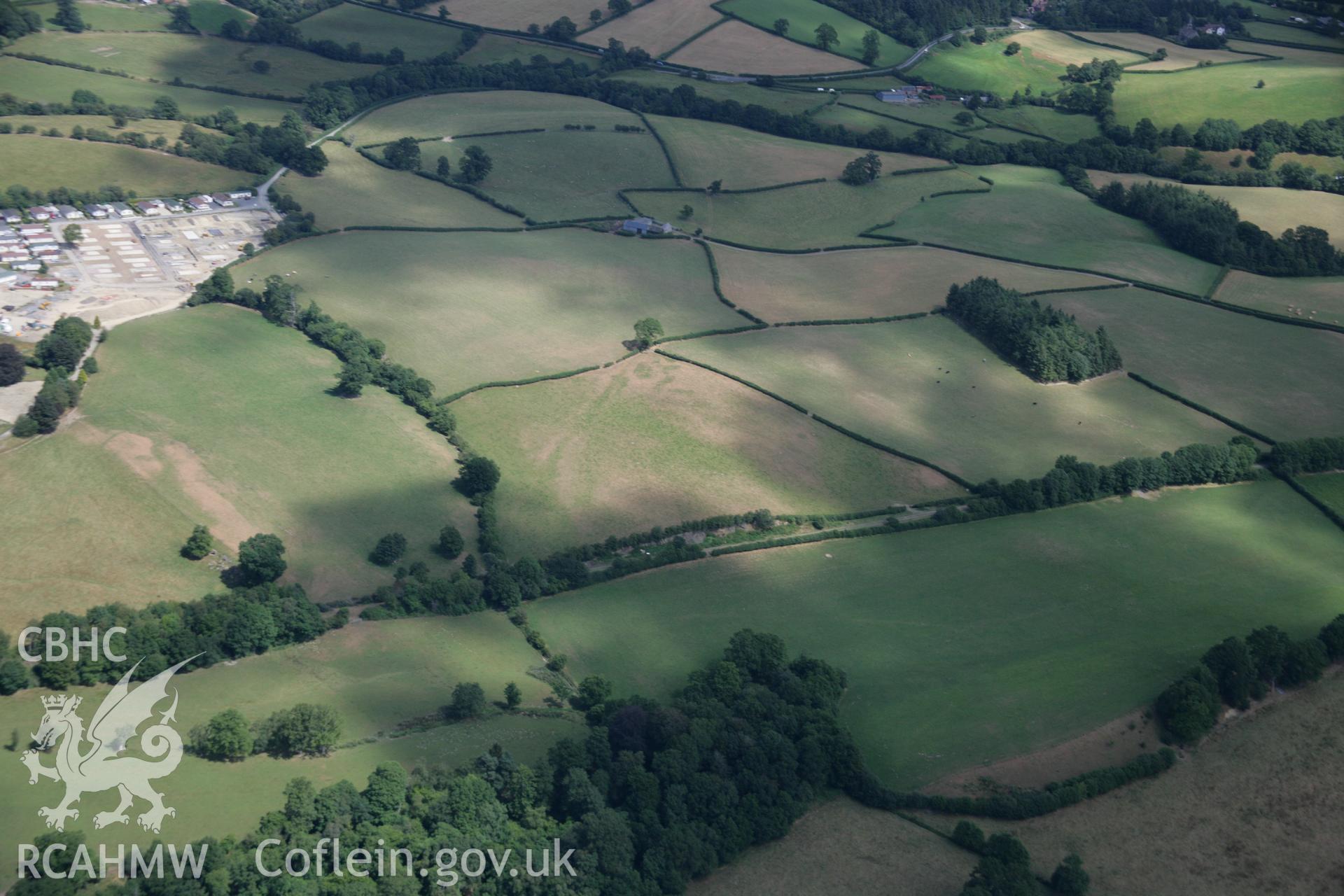 RCAHMW colour oblique aerial photograph of parchmarks showing Penmincae to Caerwnon Roman Road. Taken on 27 July 2006 by Toby Driver.