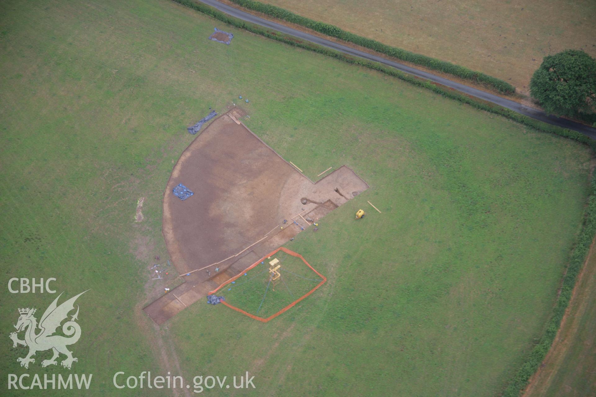 RCAHMW colour oblique aerial photograph of Dyffryn Lane Henge during excavation. Taken on 31 July 2006 by Toby Driver.