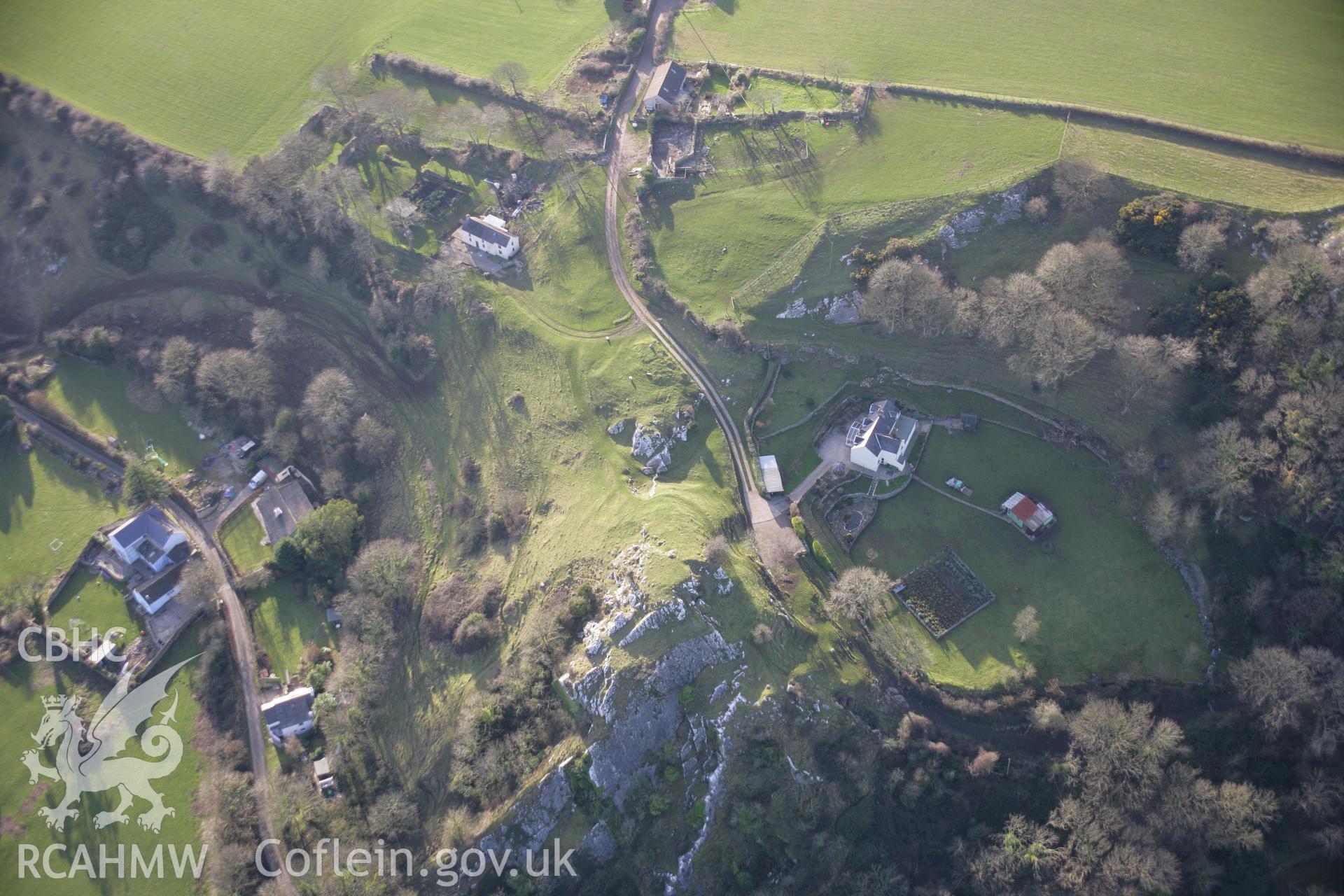 RCAHMW colour oblique aerial photograph of Landimor Castle (Bovehill Castle), and earthworks of shrunken settlement, viewed from the north-east. Taken on 26 January 2006 by Toby Driver