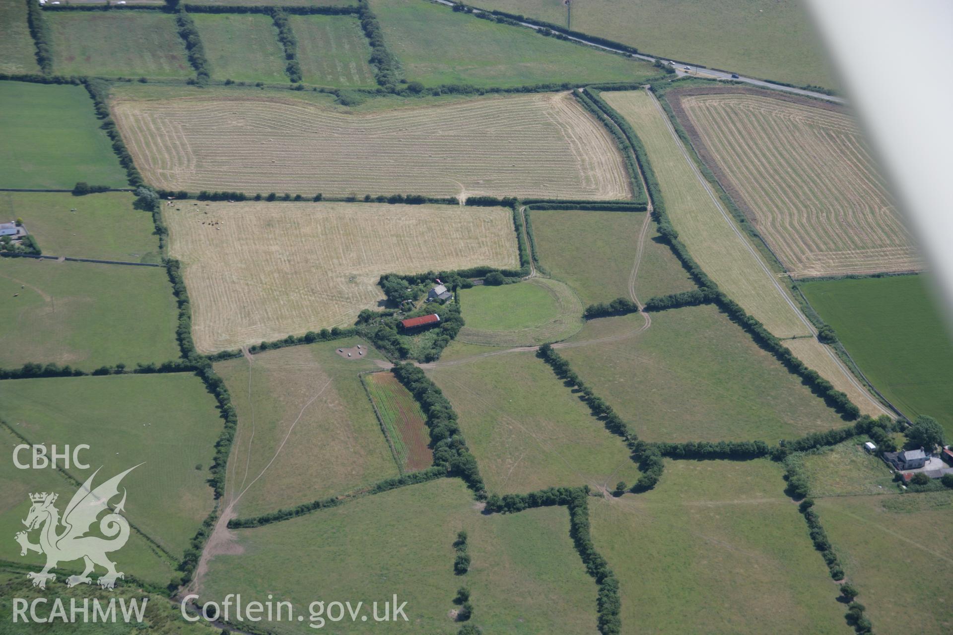 RCAHMW colour oblique aerial photograph of Castell Bryn Gwyn Neolithic Henge and Later Ringwork. Taken on 18 July 2006 by Toby Driver.